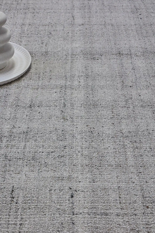 Crown - Light Grey is a Modern/Contemporary textured hand tufted Wool and Polyester rug with a pile height of 12-14mm. Colours Light Grey with Grey accents. Sizes 160 X 230, 200 X 290, and 240 X 340. Life.