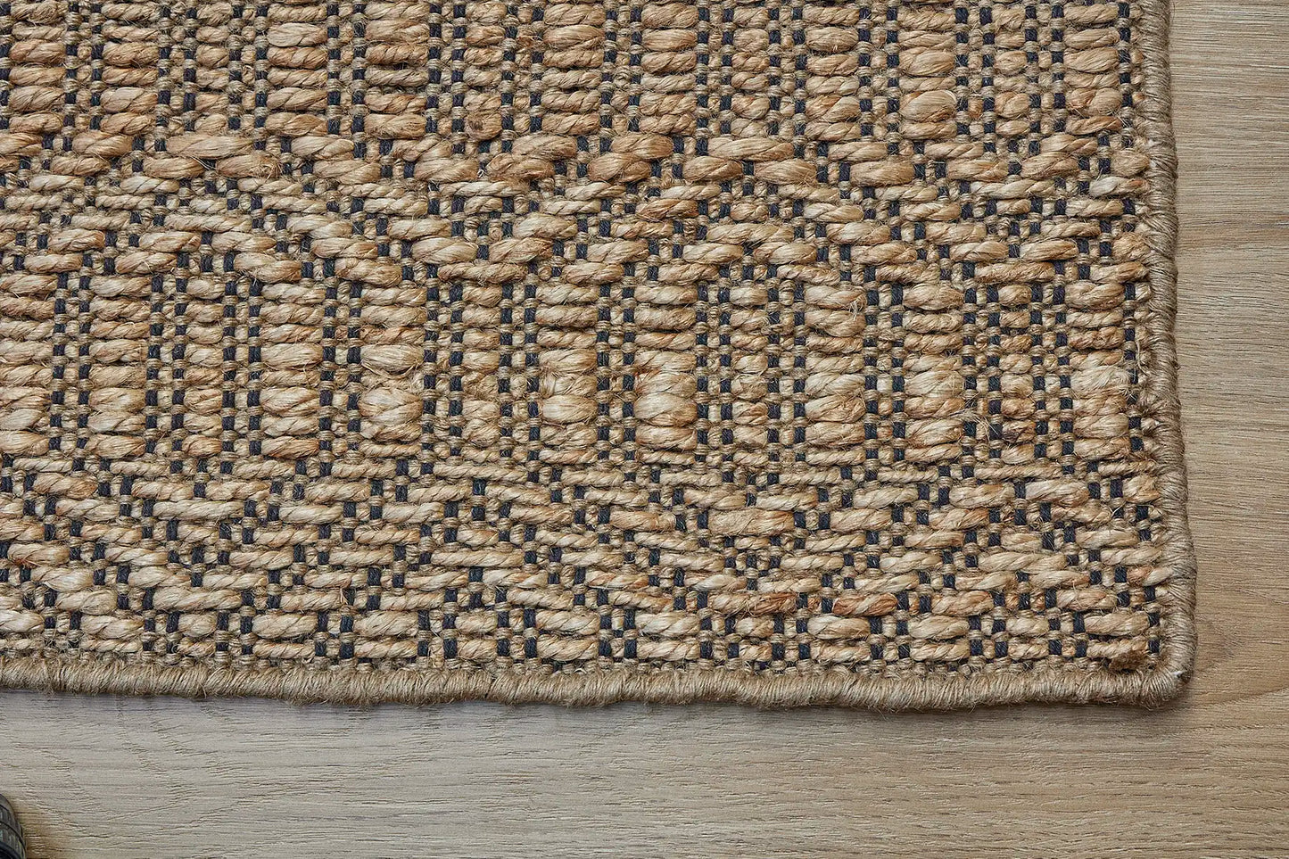Daintree - Nevada is a rug made with panja hand woven natural coloured jute. Features a 7-9mm pile height and geometic design. Colour Natural with Black. Sizes 160 X 230, 200 X 290 and 240 X 340. Corner.