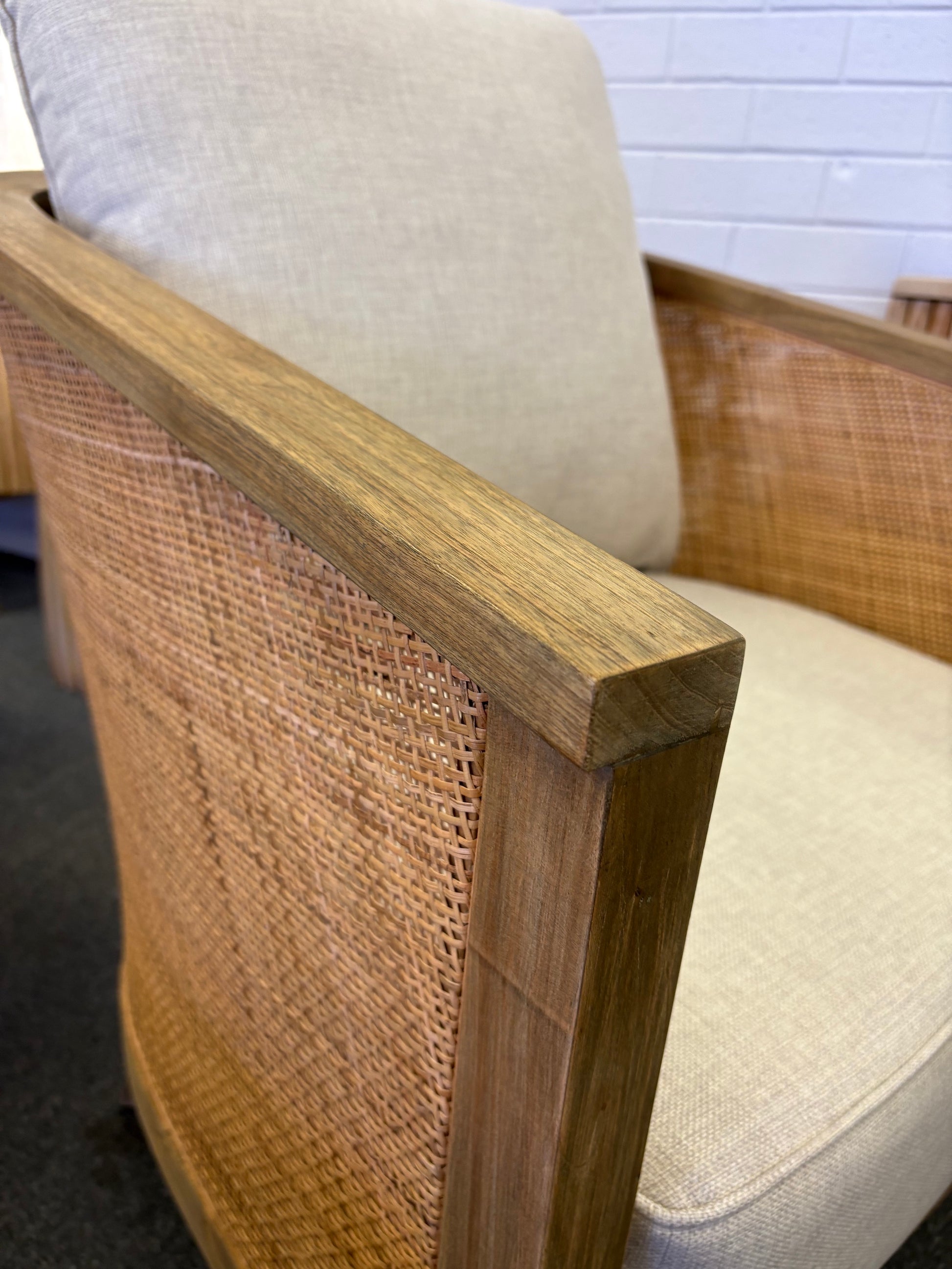 The Daisy Occasional Chair. Teak Frame wrapped in open mesh rattan. Includes cushioned seat and back. Colour Natural Teak and Rattan with cream cotton twill cushions. Measures 700 Wide X 800 Depth X 750 Back Height. Angle.