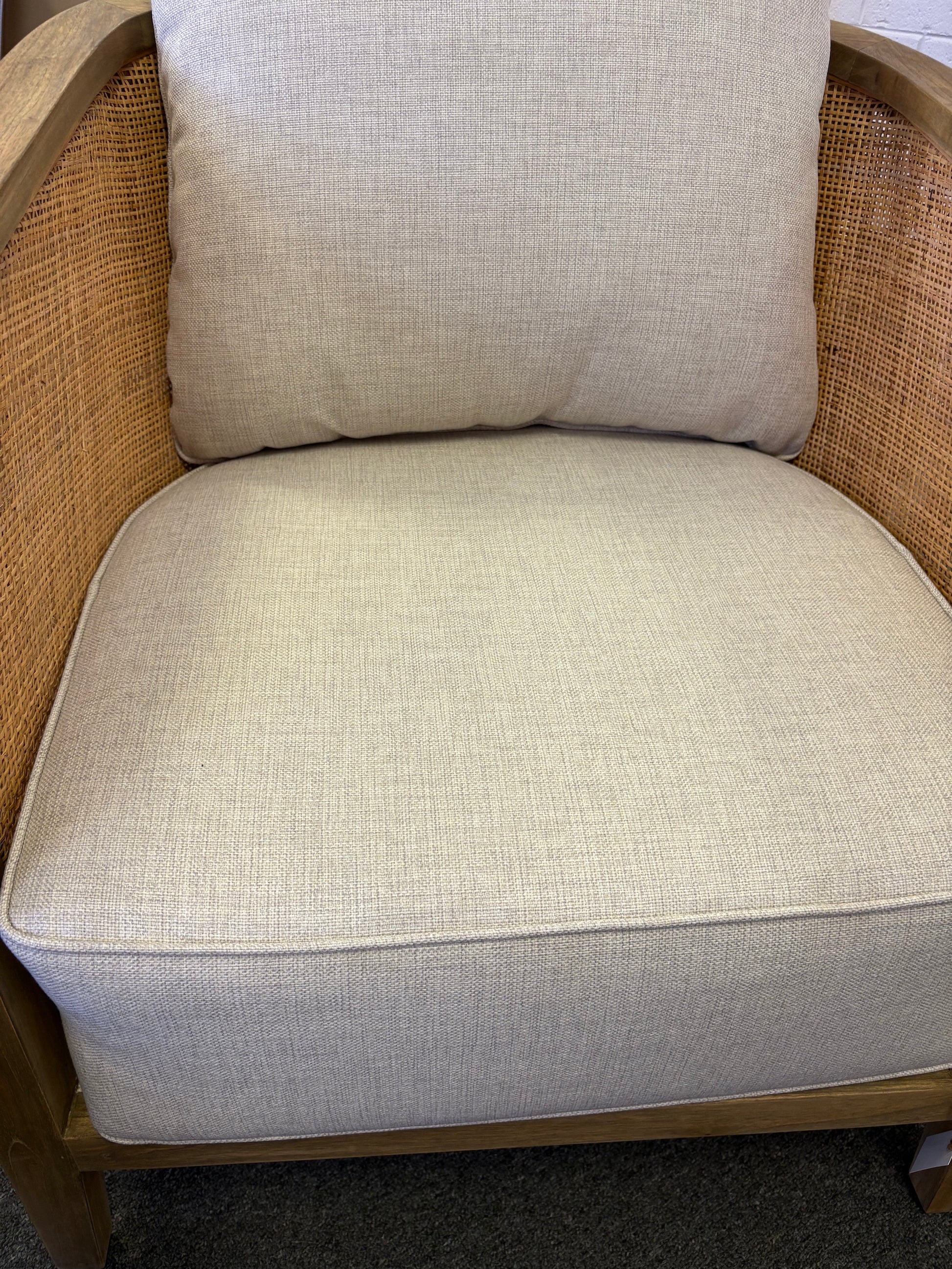 The Daisy Occasional Chair. Teak Frame wrapped in open mesh rattan. Includes cushioned seat and back. Colour Natural Teak and Rattan with cream cotton twill cushions. Measures 700 Wide X 800 Depth X 750 Back Height. Front Close.