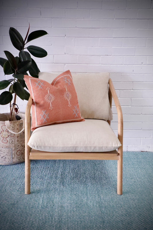 The Daisy Occasional Chair - Its solid teak frame adds a touch of elegance, while beige cotton twill cushions provide comfort. Measures 740 Wide X 850 Depth X 850 Height - 450 Seat Height. Styled.