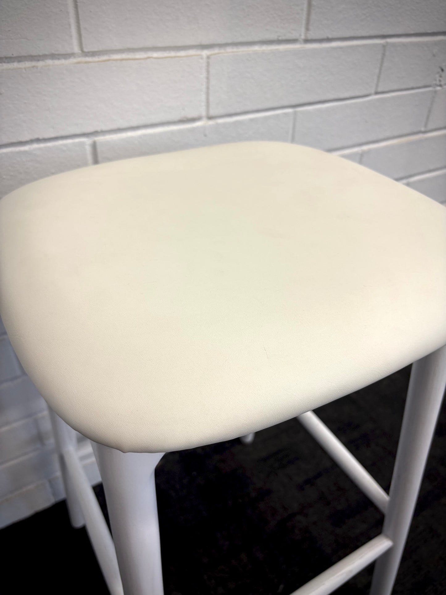 The Danube - White Barstool. A contemporary style barstool. Solid natural ash frame with tan polyurethane seat. Measures  400W X 400D X 670 Seat Height. Close.