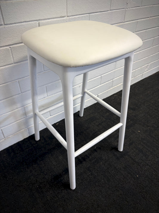 The Danube - White Barstool. A contemporary style barstool. Solid natural ash frame with tan polyurethane seat. Measures  400W X 400D X 670 Seat Height. Side.