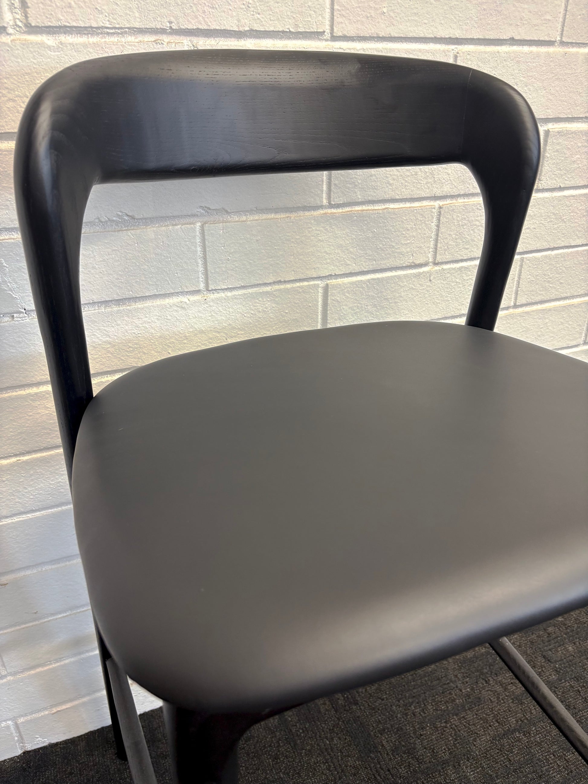 The Danube, with Back, Black Barstool. A blend of modern and contemporary style. Solid black ash frame with black polyurethane seat. Measures  470W X 450D X 670 Seat Height. Back Height 920. Close.
