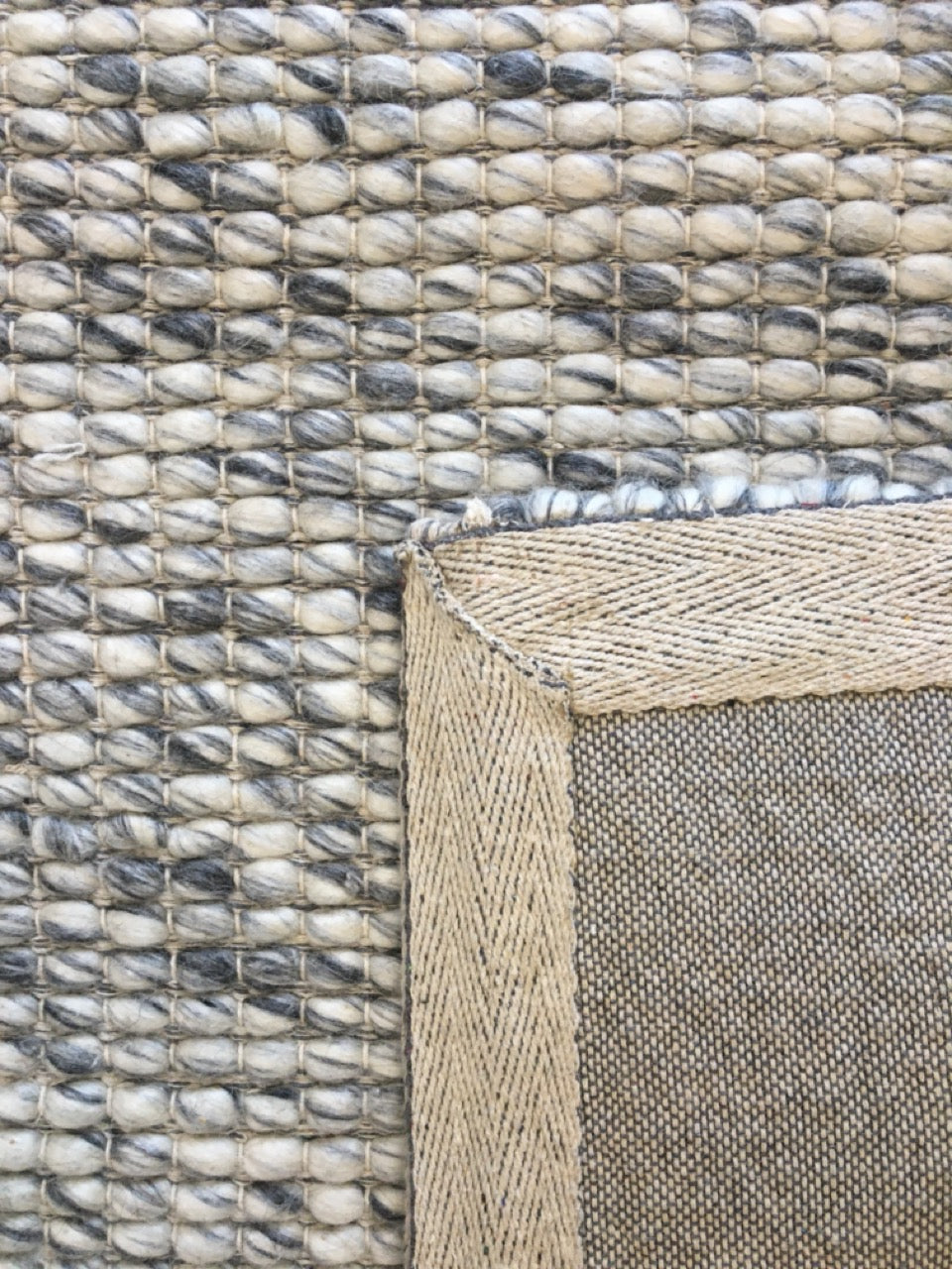 Dasha Grey is a texture hand woven rug made of 80%  New Zealand Wool and 20% Polyester. Colour Grey. Sizes 155 X 225, 200 X 290, 240 X 320 and 300 X 400. Fold.