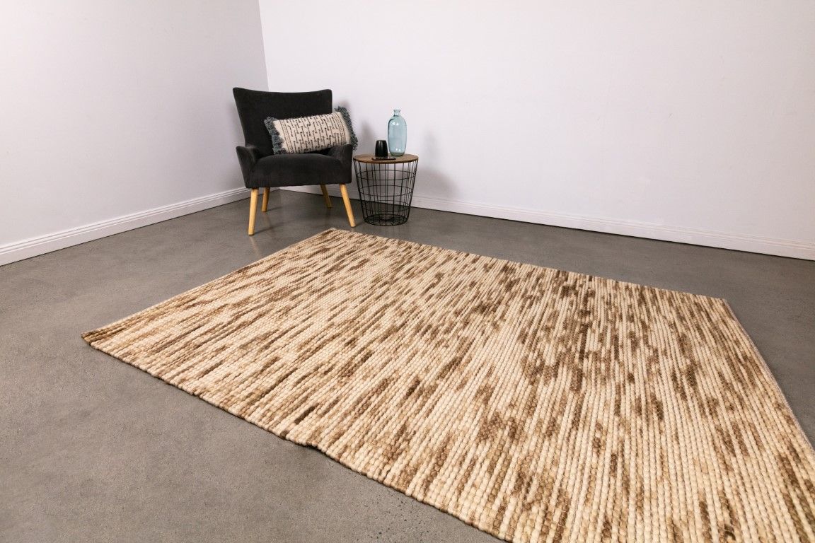Dasha Natural is a texture hand woven rug made of 80%  New Zealand Wool and 20% Polyester. Colour Beige with Brown accents. Sizes 155 X 225, 200 X 290, 240 X 320 and 300 X 400. Life.