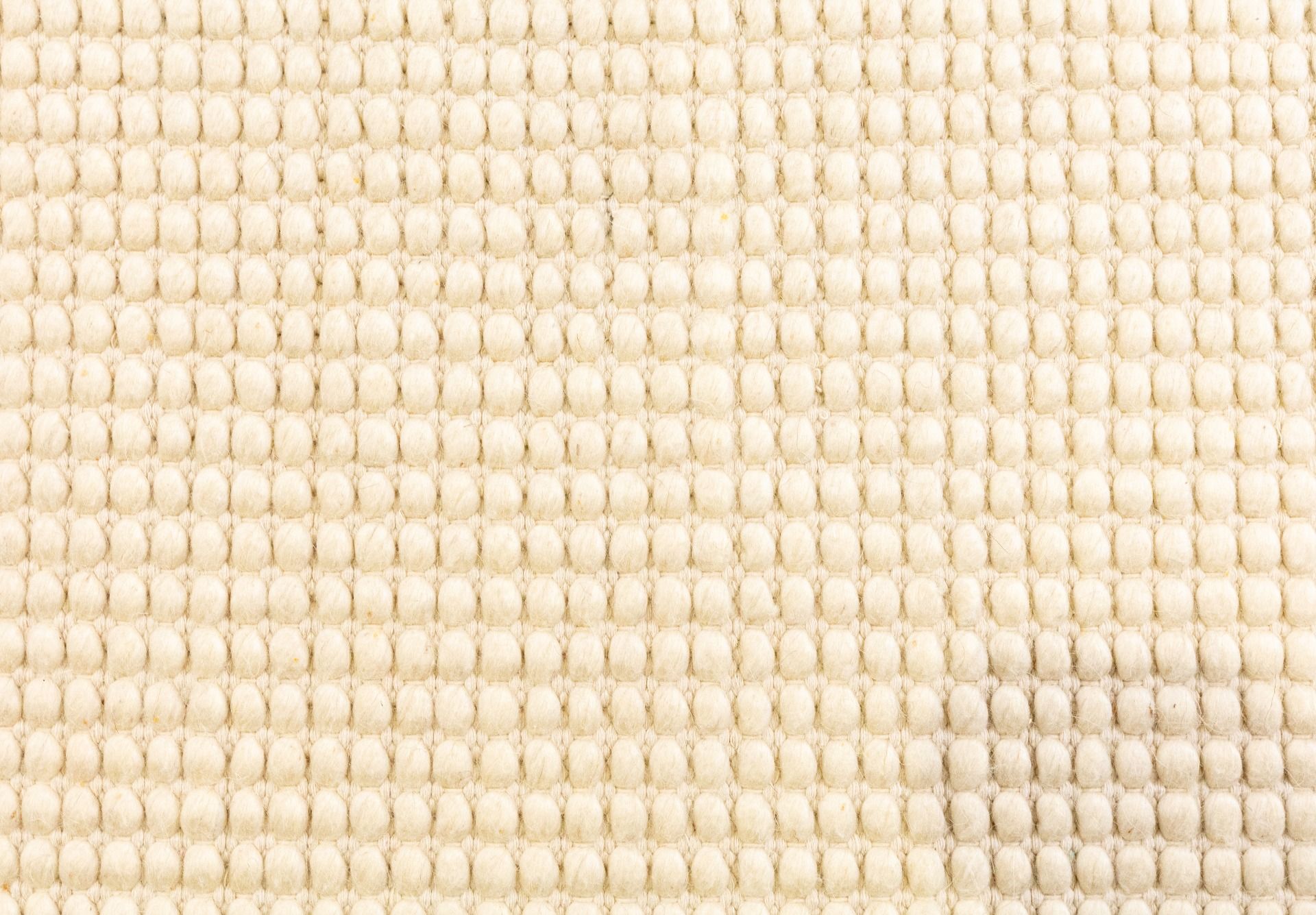 Dasha Round - Cream rug. Made of 80% wool and 20% polyester, this round rug features a unique textured design that adds a cozy and inviting feel to any room. Measuring 200cm in diameter. Close.