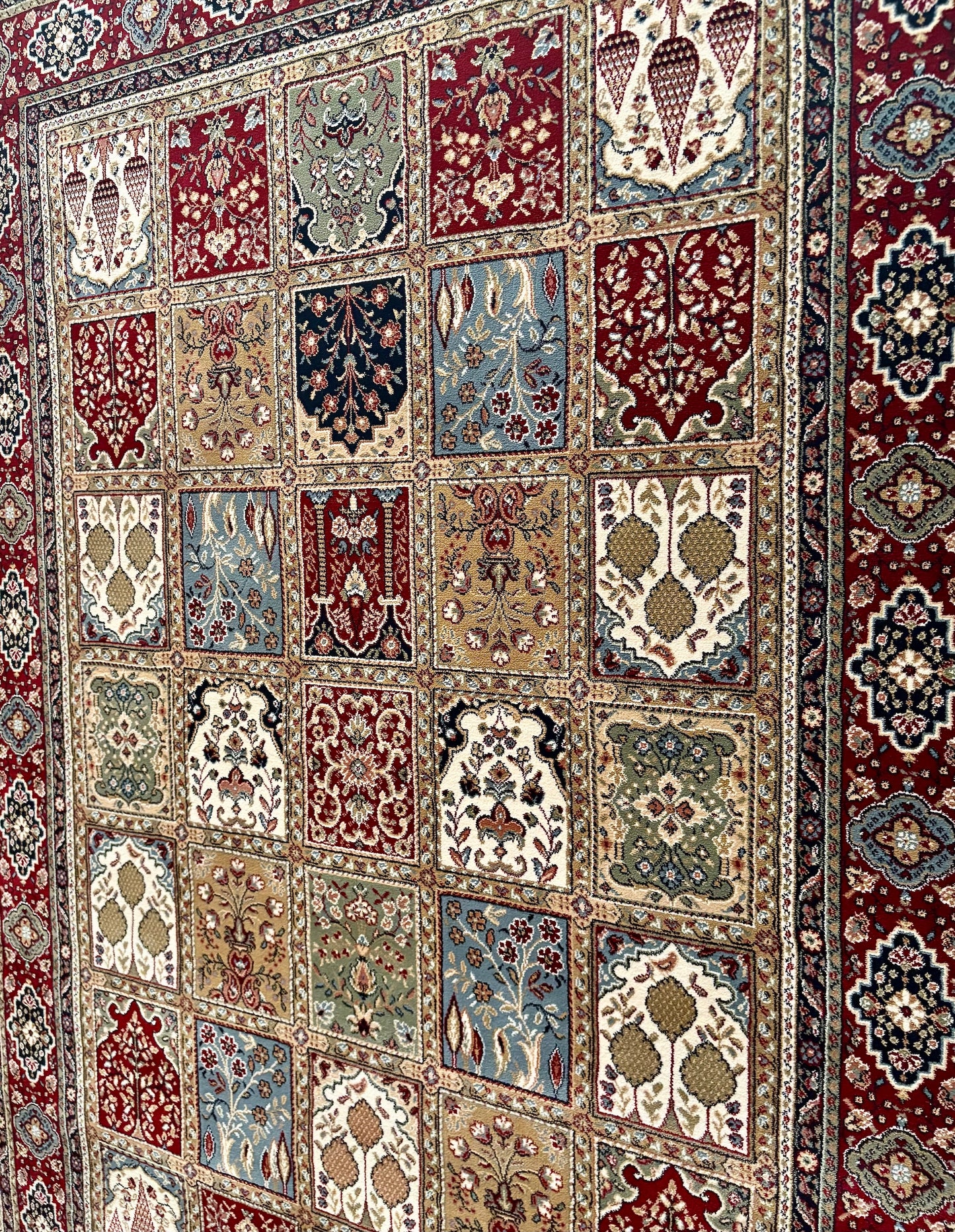 The Davinci Bakhtiari Dark Persian Rug. Machine made and crafted with heat-set polypropylene for long-lasting durability. Featuring a traditional Persian design. Colours, multi. 4 Sizes. Angle.