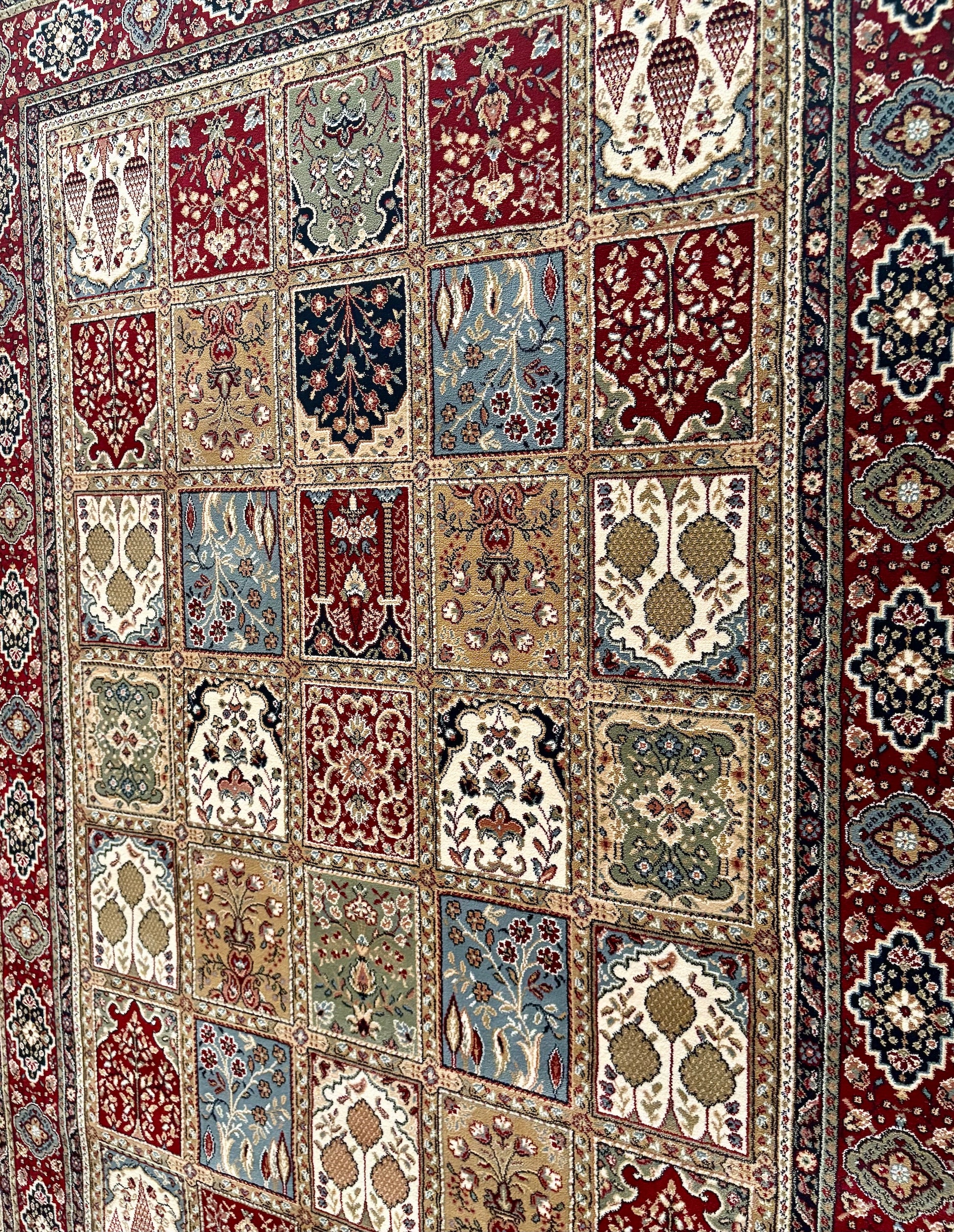 The Davinci Bakhtiari Dark Persian Rug. Machine made and crafted with heat-set polypropylene for long-lasting durability. Featuring a traditional Persian design. Colours, multi. 4 Sizes. Angle.