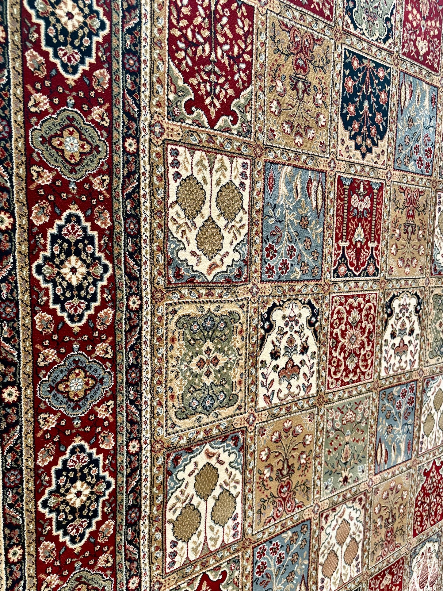 The Davinci Bakhtiari Dark Persian Rug. Machine made and crafted with heat-set polypropylene for long-lasting durability. Featuring a traditional Persian design. Colours, multi. 4 Sizes. Close Angle.