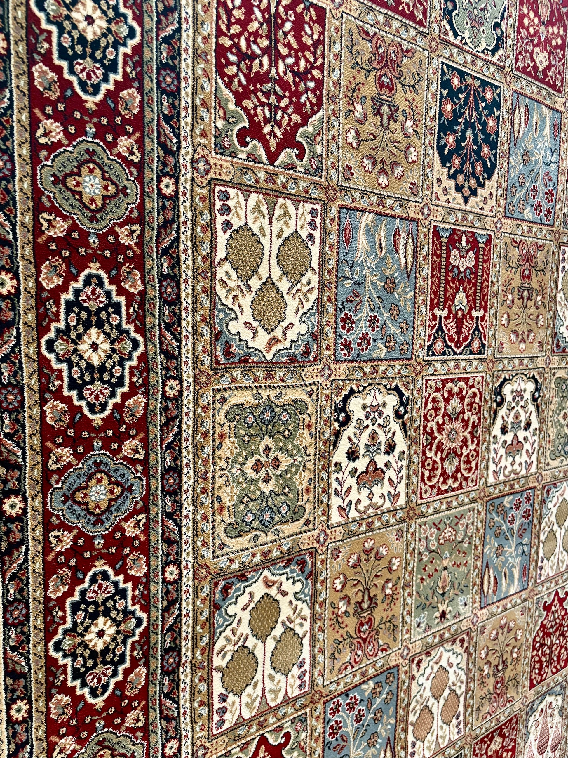 The Davinci Bakhtiari Dark Persian Rug. Machine made and crafted with heat-set polypropylene for long-lasting durability. Featuring a traditional Persian design. Colours, multi. 4 Sizes. Close Angle.