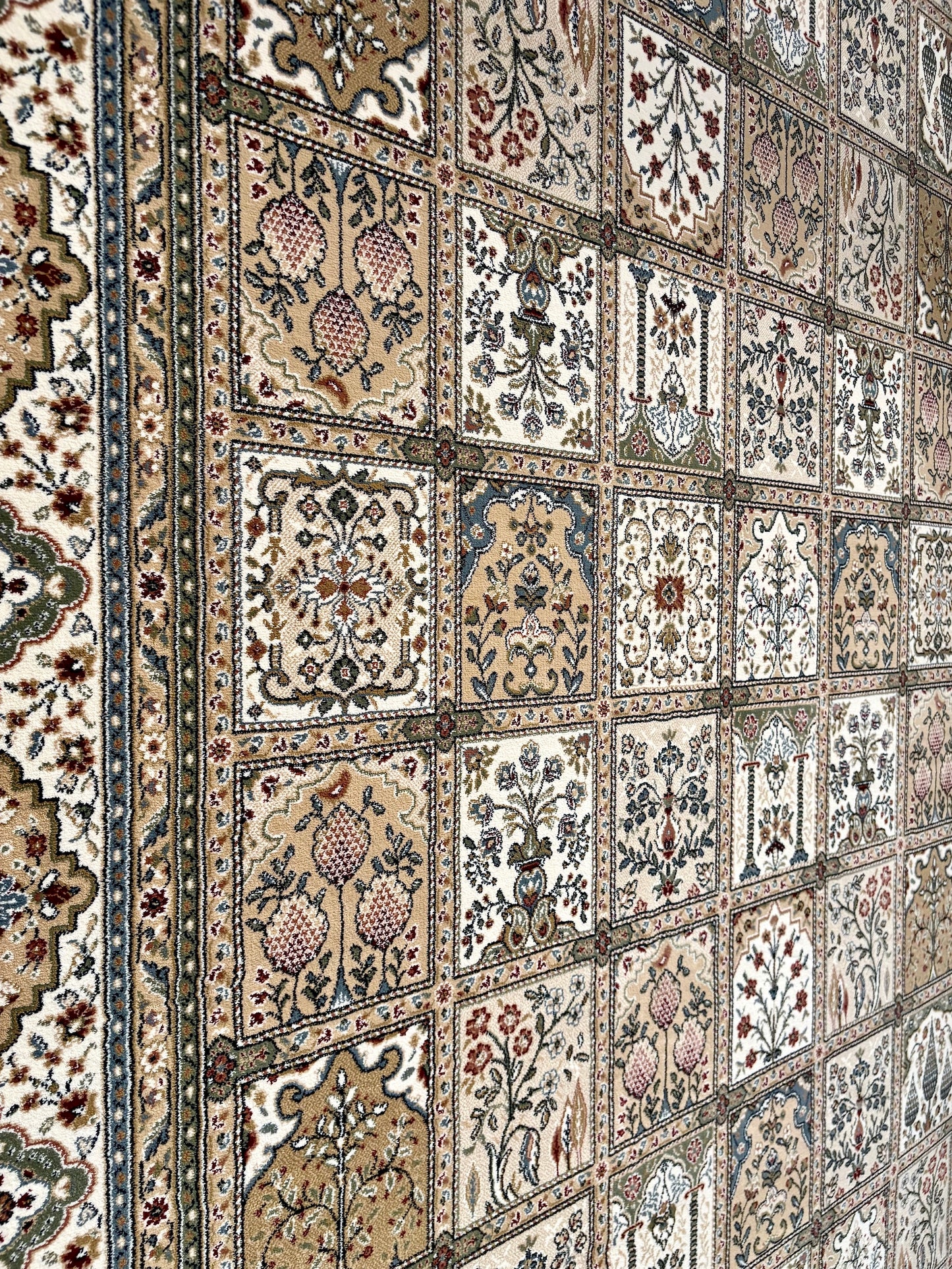 Davinci Bakhtiari Light Persian Rug. Machine made and specially crafted with heat-set polypropylene for long-lasting durability. Featuring a traditional Persian design. Colours, beige/multi. 3 sizes. Close Angle.