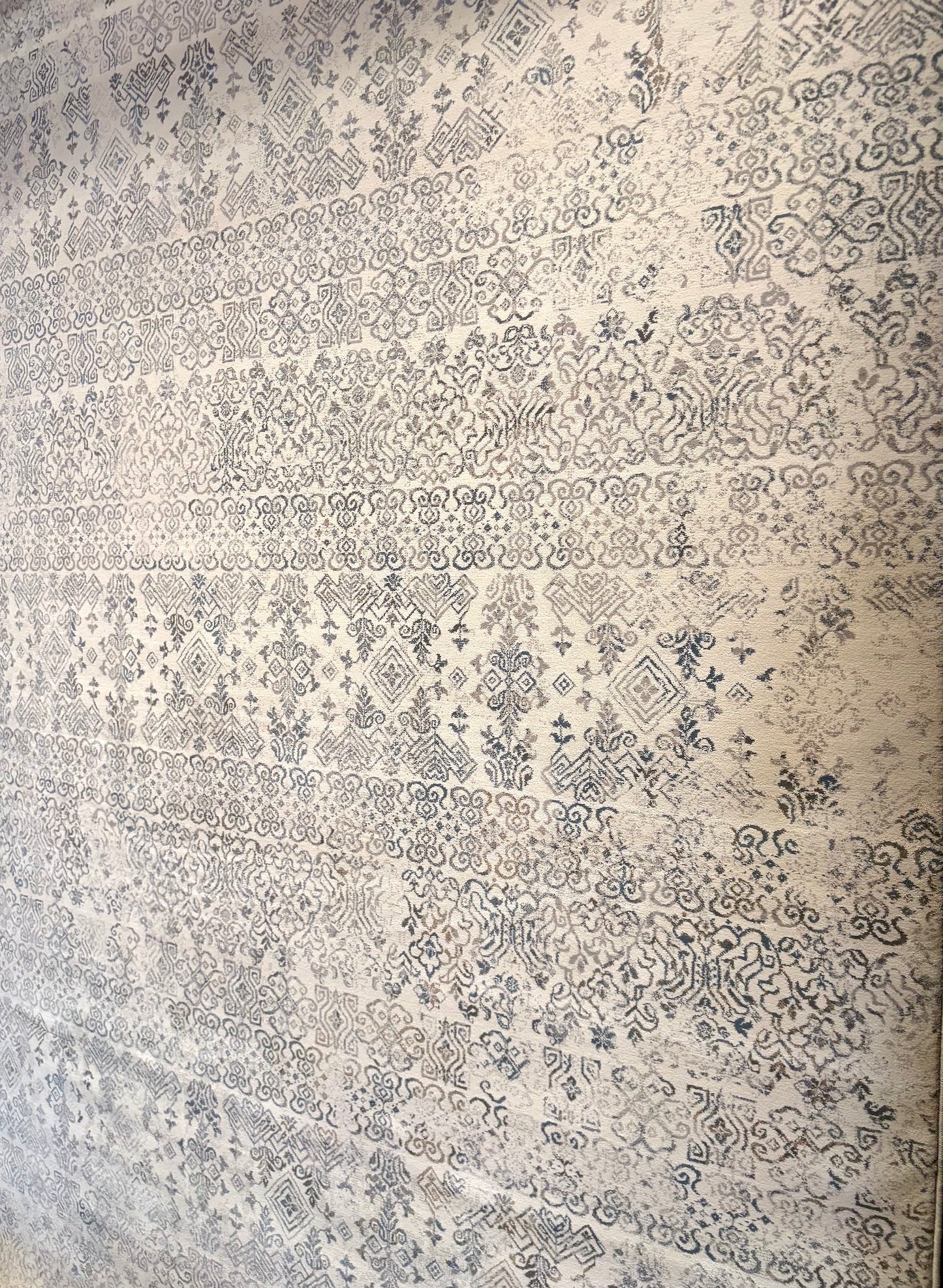 The Davinci Caucasian Silver Persian Rug. Featuring a traditional Persian design this machine made rug is constructed with heat-set polypropylene. Colours light beige with grey accents. 3 Sizes. Angle.