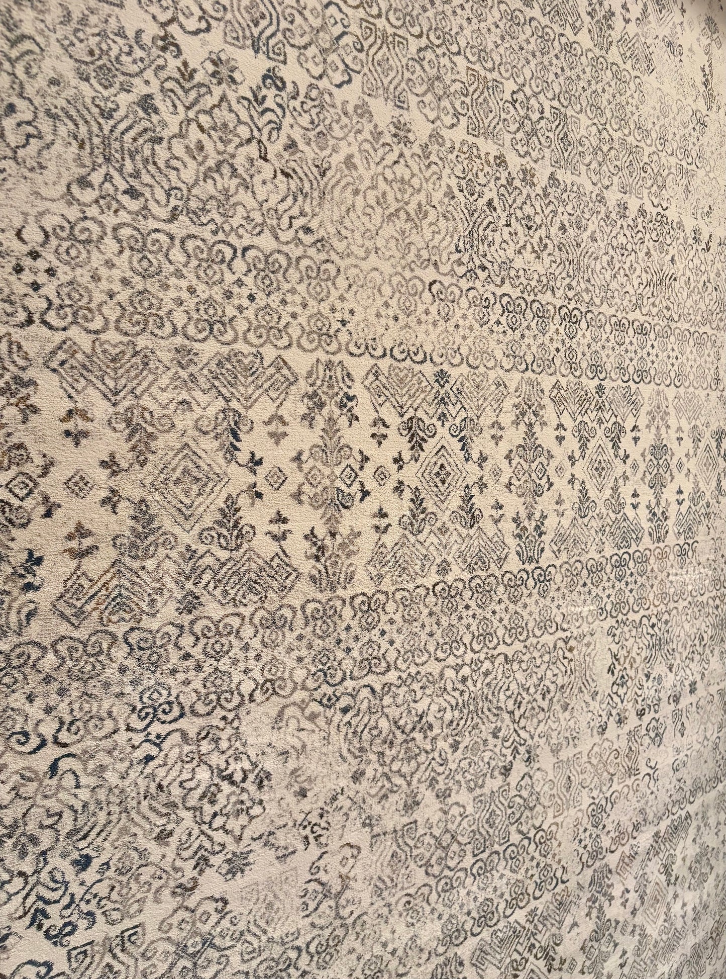 The Davinci Caucasian Silver Persian Rug. Featuring a traditional Persian design this machine made rug is constructed with heat-set polypropylene. Colours light beige with grey accents. 3 Sizes. Close Angle.