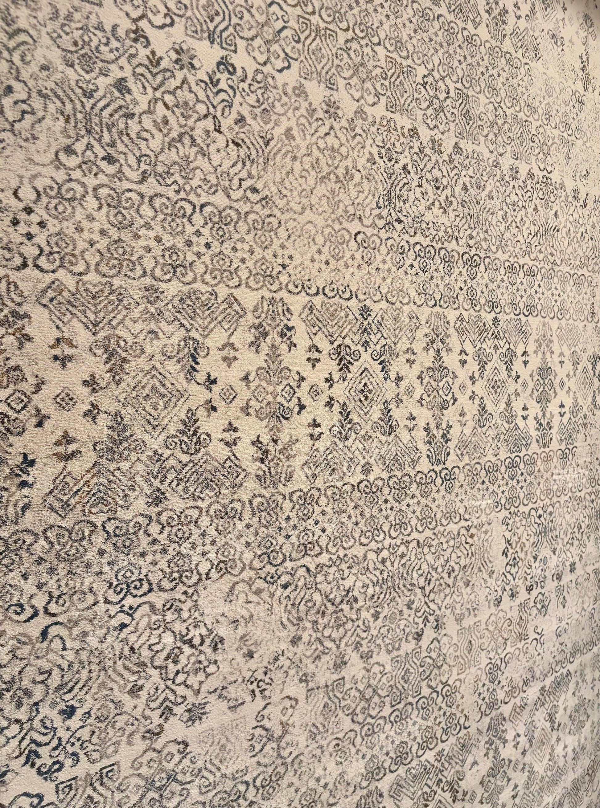 The Davinci Caucasian Silver Persian Rug. Featuring a traditional Persian design this machine made rug is constructed with heat-set polypropylene. Colours light beige with grey accents. 3 Sizes. Close Angle.