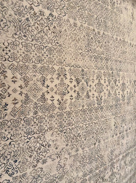 The Davinci Caucasian Silver Persian Rug. Featuring a traditional Persian design this machine made rug is constructed with heat-set polypropylene. Colours light beige with grey accents. 3 Sizes. Close Angle.