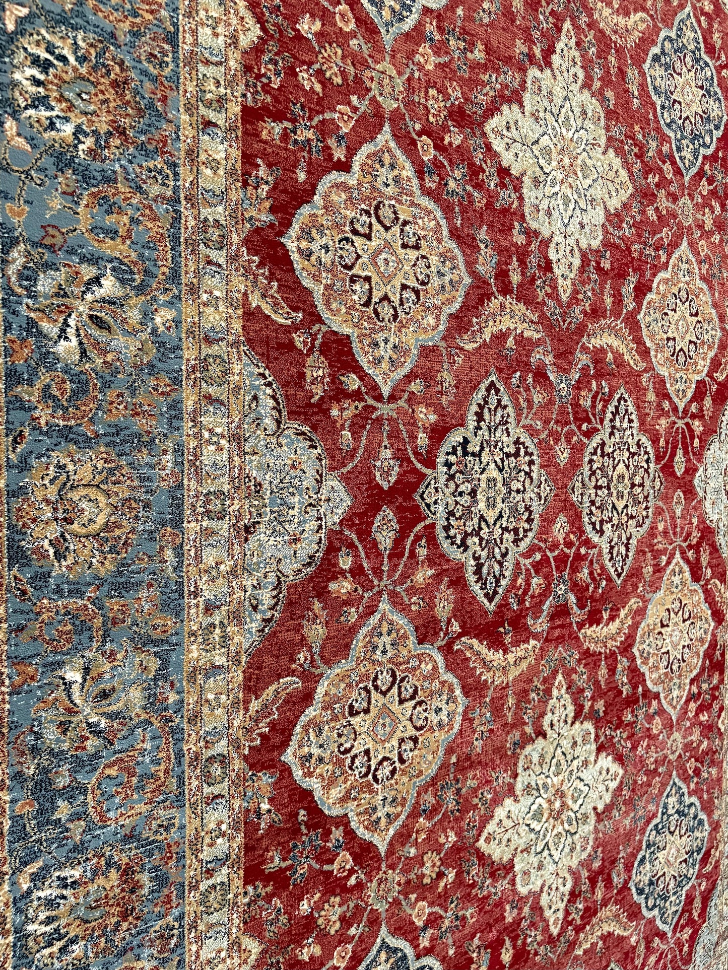 The Davinci Heriz Red Persian Rug. Machine made and crafted from durable heat-set polypropylene. The classic  Persian design will elevate your home decor. Colours, reds, blues, beiges. 4 Sizes. Close Angle.