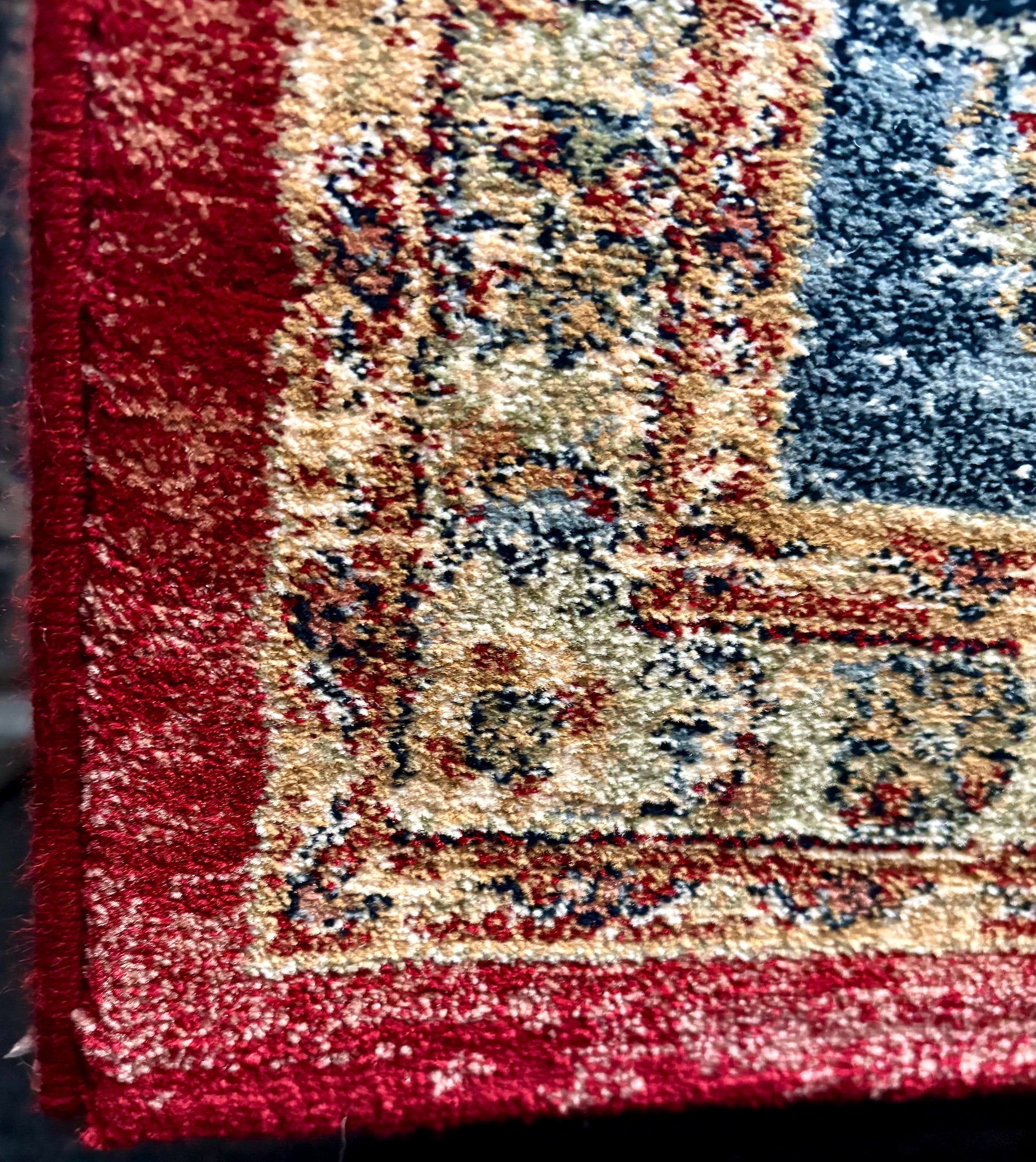The Davinci Heriz Red Persian Rug. Machine made and crafted from durable heat-set polypropylene. The classic  Persian design will elevate your home decor. Colours, reds, blues, beiges. 4 Sizes. Corner.