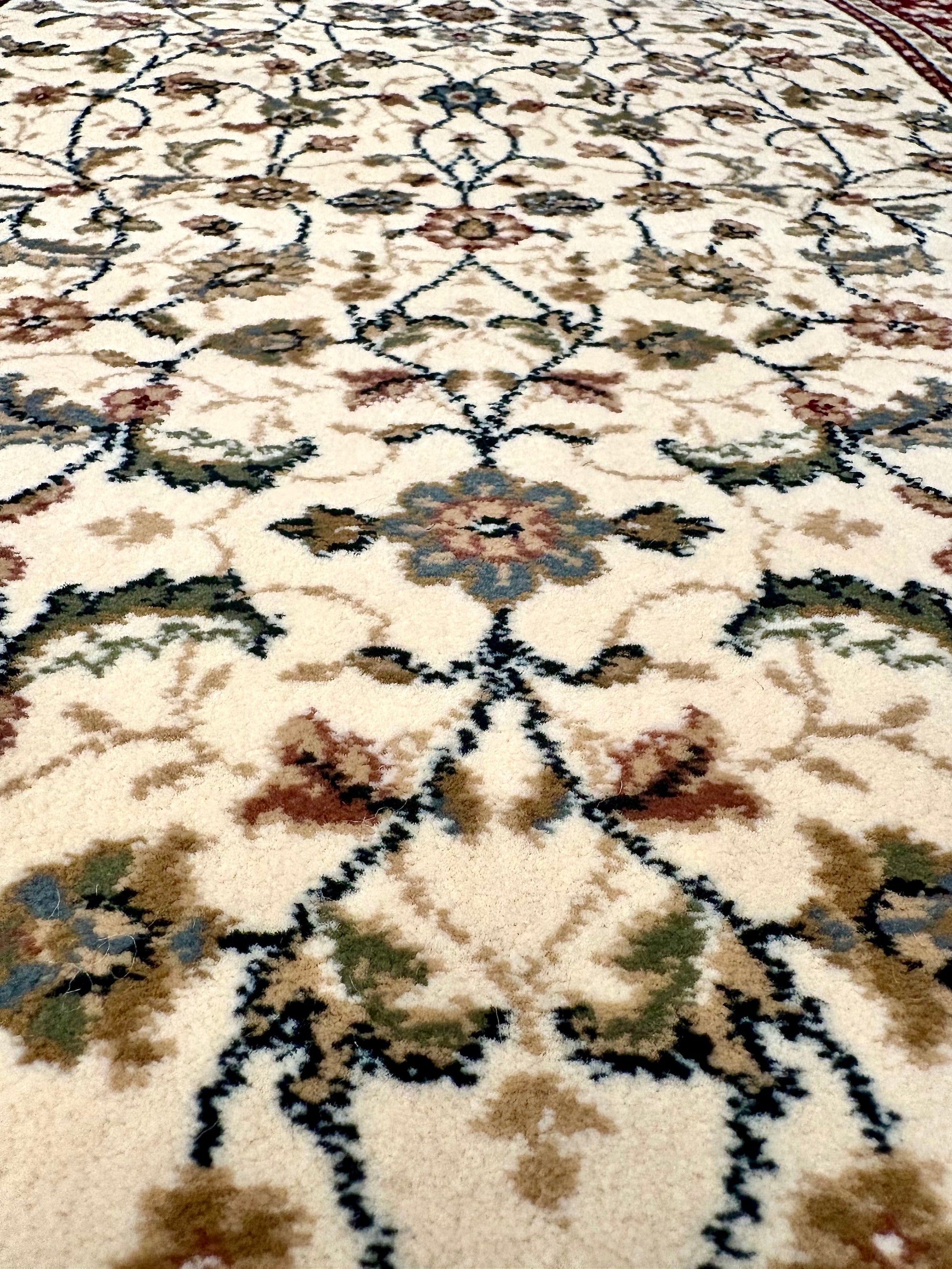 The Davinci Isfahan Beige machine-made Persian rug offers lasting style and durability, expertly crafted with heat-set polypropylene for enduring comfort. Colours, reds, beiges, greys. 4 Sizes. Centre.