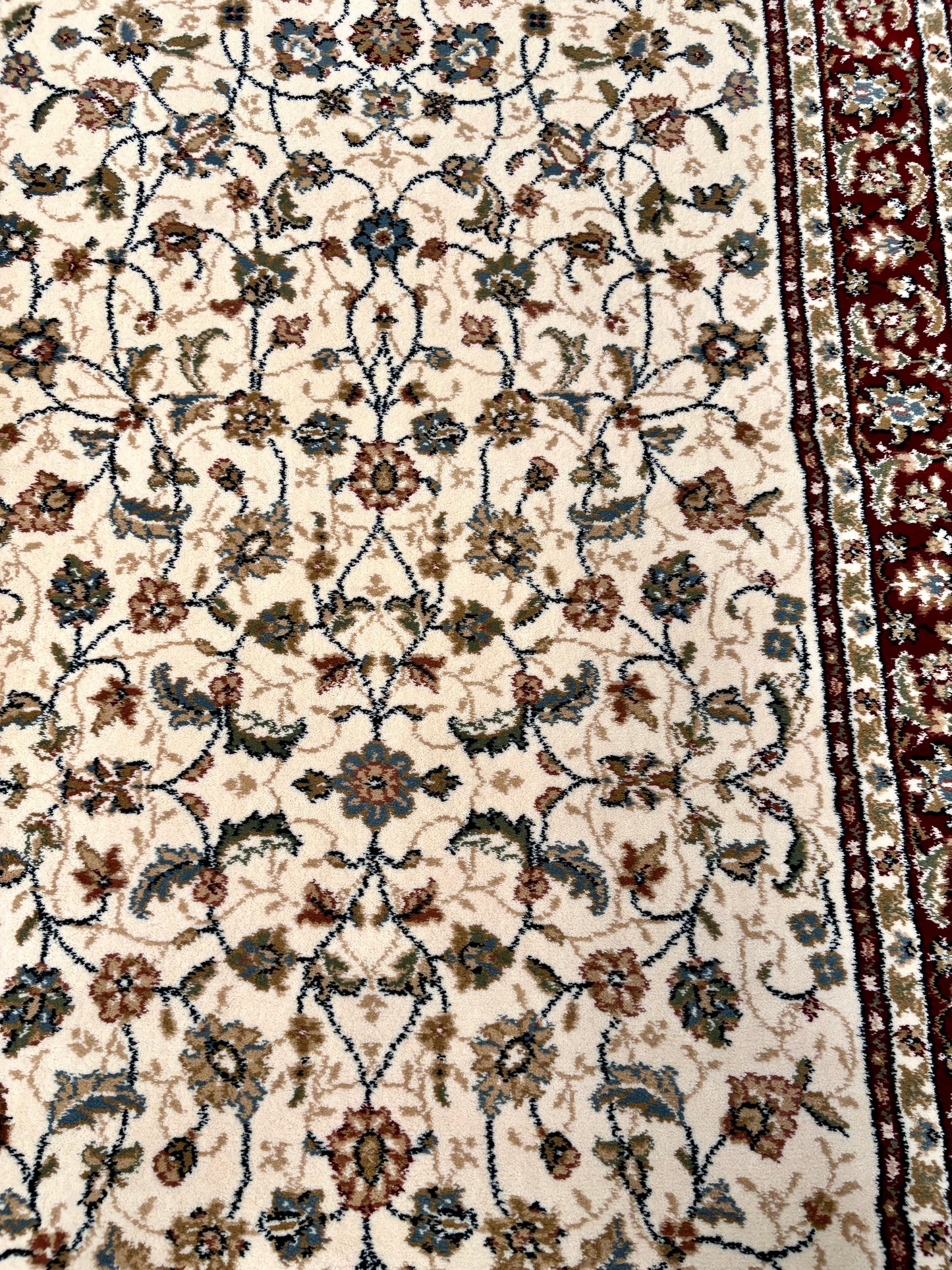 The Davinci Isfahan Beige machine-made Persian rug offers lasting style and durability, expertly crafted with heat-set polypropylene for enduring comfort. Colours, reds, beiges, greys. 4 Sizes. Top Close.