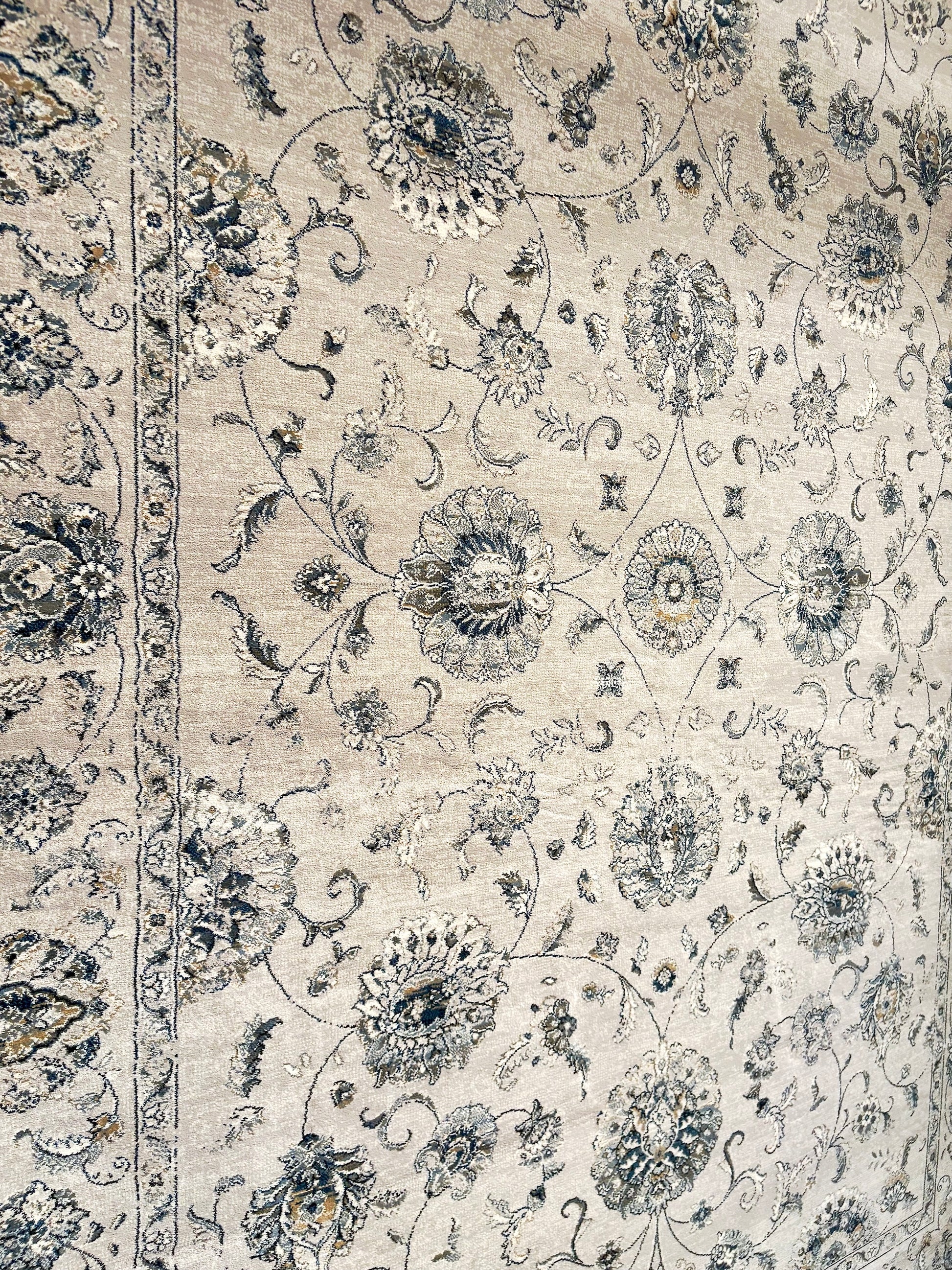 The Davinci Kashan Light Grey Persian Rug. Machine made and crafted from durable heat-set polypropylene. The classic Persian design will elevate your home decor. Colours, Greys. 4 Sizes. Side Angle.