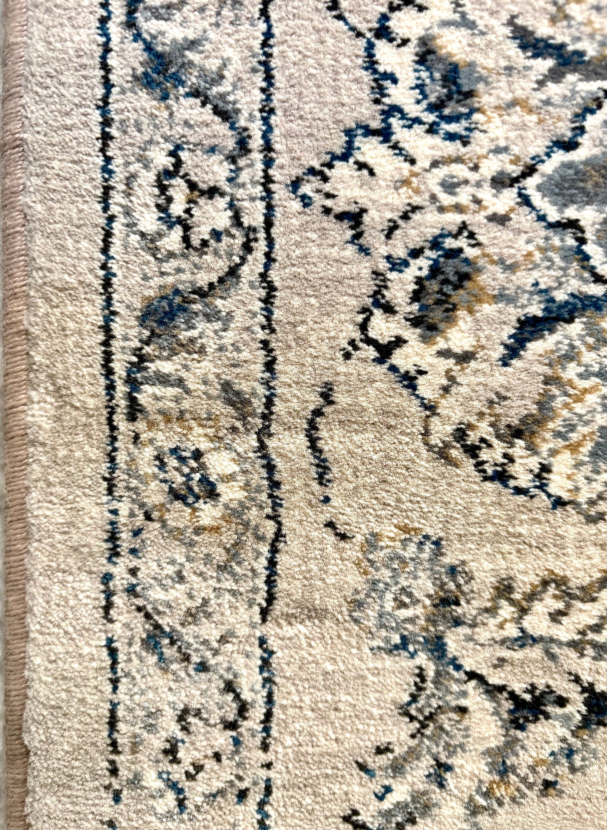 The Davinci Kashan Light Grey Persian Rug. Machine made and crafted from durable heat-set polypropylene. The classic Persian design will elevate your home decor. Colours, Greys. 4 Sizes. Side Close.