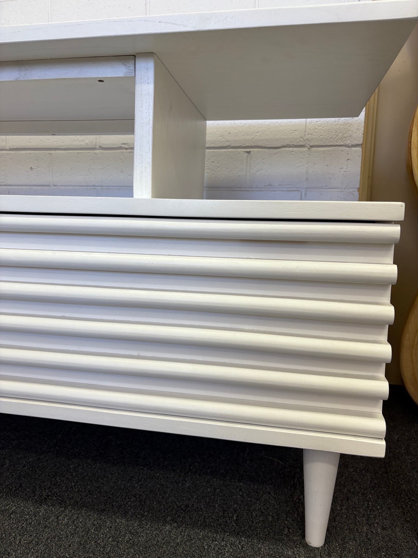 The Dean White 2400 Entertainment Unit features a floating top shelf.  With 3 textured drawers and stylish turned legs. Colour White. Measures 2400 Length X 400 Depth X 650 Height. Corner.