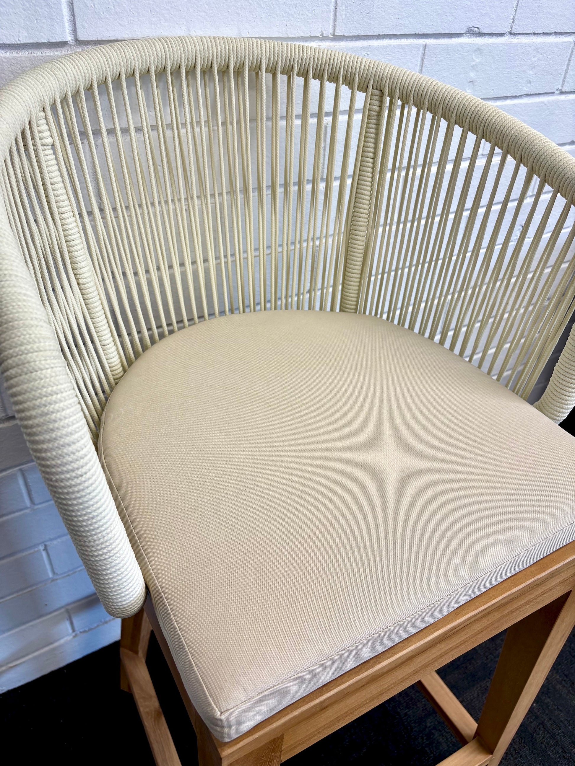 Deschutes with back barstool with solid teak wood frame,woven rope back and cotton twill seat cushion. Featuring a clean, minimalist design suitable for coastal and contemporary interiors. Measures 560 Wide X 450 Depth X 700 Seat Height X 1040 Back Height. Front Plain. Close.