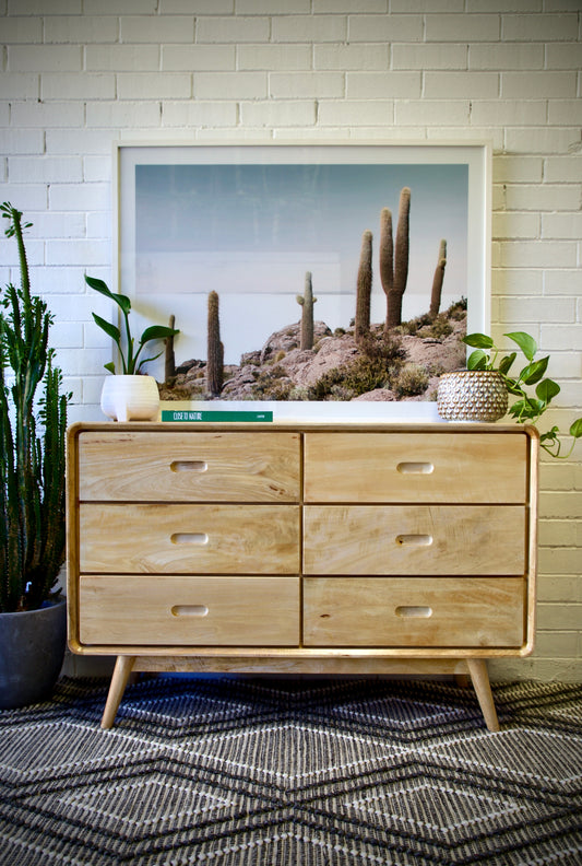 The Dorrigo 6 Drawer chest is crafted from sustainable fruitwood. Its contemporary design gives off a timeless aesthetic. With a 3 height X 2 wide configuration its 6 drawers slide on wooden runners. Colour natural. Measures 1200 length X 450 depth X 800 height. Front Styled.