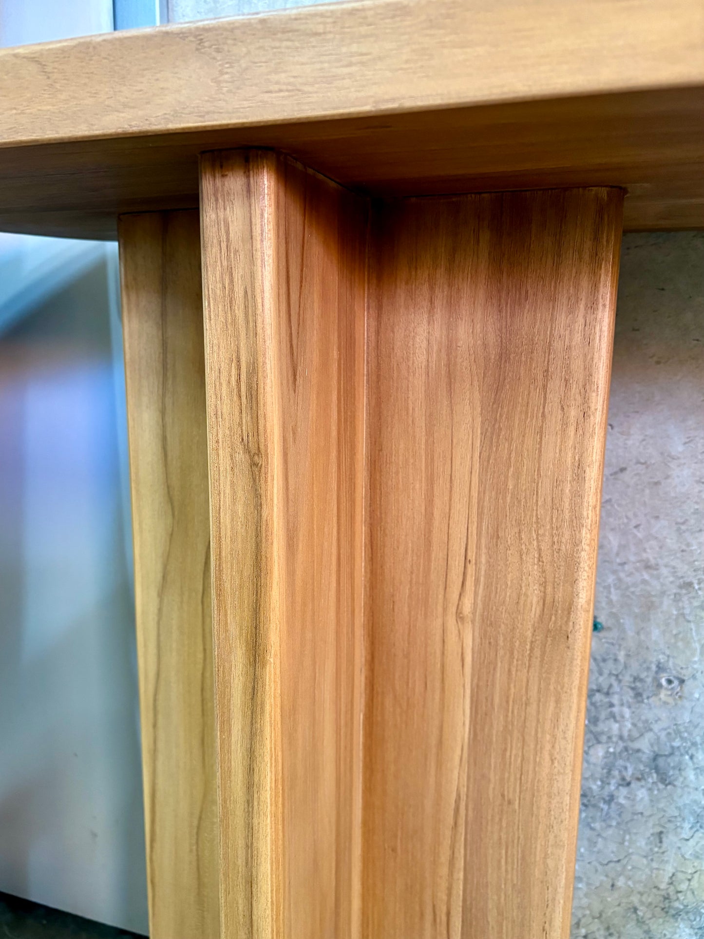 Dublin Teak Top Console crafted from solid teak. Featuring solid teak top with rounded ends and solid panel-styled pillar supports. Colour Natural Teak. Measures 1800 Wide X 380 Depth X 800 Height. Angle Leg.