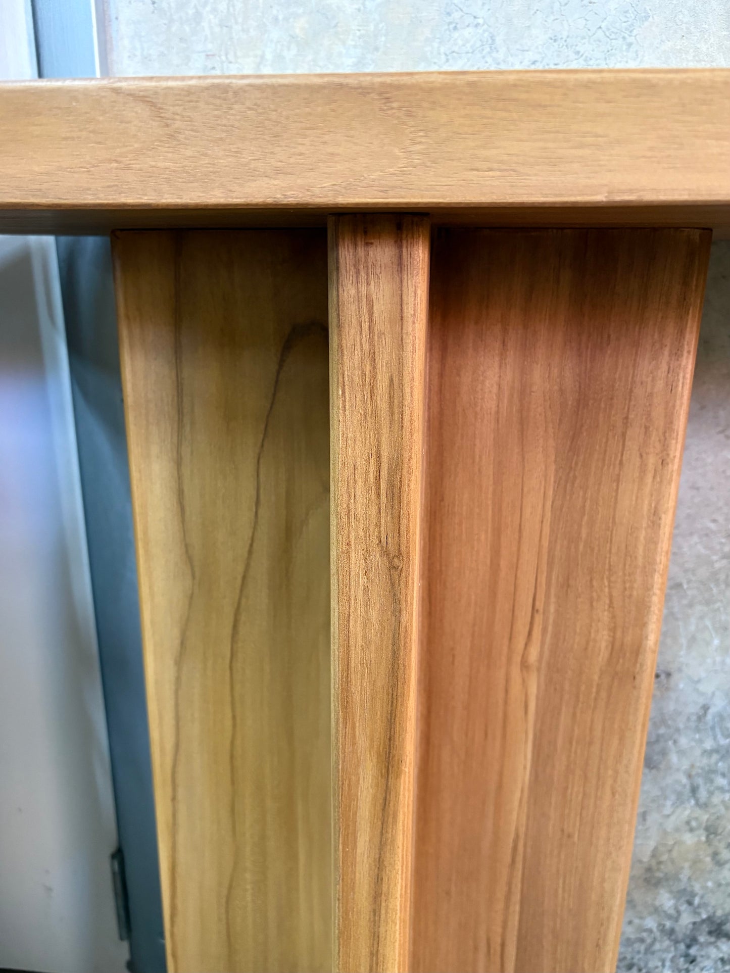 Dublin Teak Top Console crafted from solid teak. Featuring solid teak top with rounded ends and solid panel-styled pillar supports. Colour Natural Teak. Measures 1800 Wide X 380 Depth X 800 Height. Front Leg.