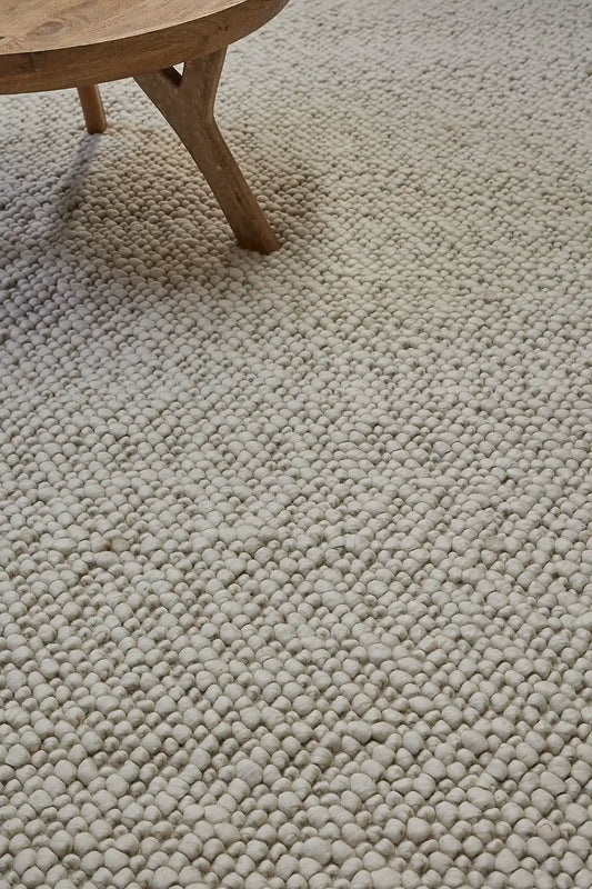 Dunes Ivory is a hand-braided wool rug, giving it a textured, luxurious feel. With a 16-18mm pile height. Colour Ivory. Sizes 160 X 230, 200 X 290 and 240 X 340. Life.