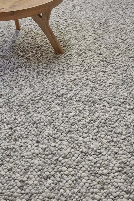Dunes Storm is a hand-braided wool rug, giving it a textured, luxurious feel. With a 16-18mm pile height. Colour Light grey and white. Sizes 160 X 230, 200 X 290 and 240 X 340. Life.
