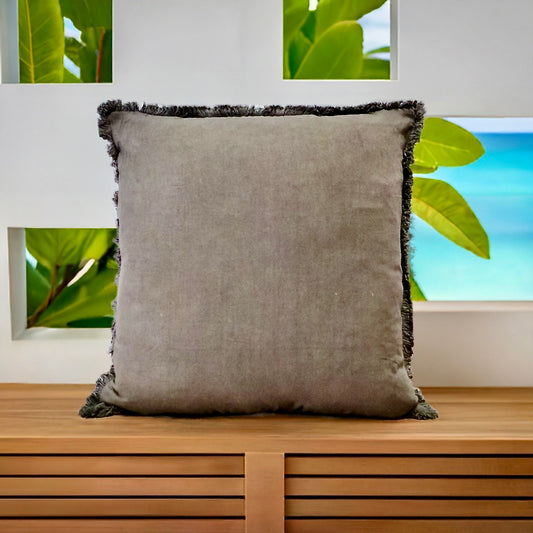 The Dusty Olive, green, throw cushion is crafted by skilled artisans in India. Made of cotton it boasts a contemporary style with a smooth luxurious cotton weave and a fringed edge. Colour green. Sizes, 50 X 50 and 60 X 60. Styled.