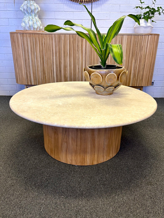 The Dylan Marble Top Coffee table is a contemporary styled round coffee table. Crafted from solid marble with a round teak base. Colour natural. Measures 1000 diameter X 400 height.  Styled.