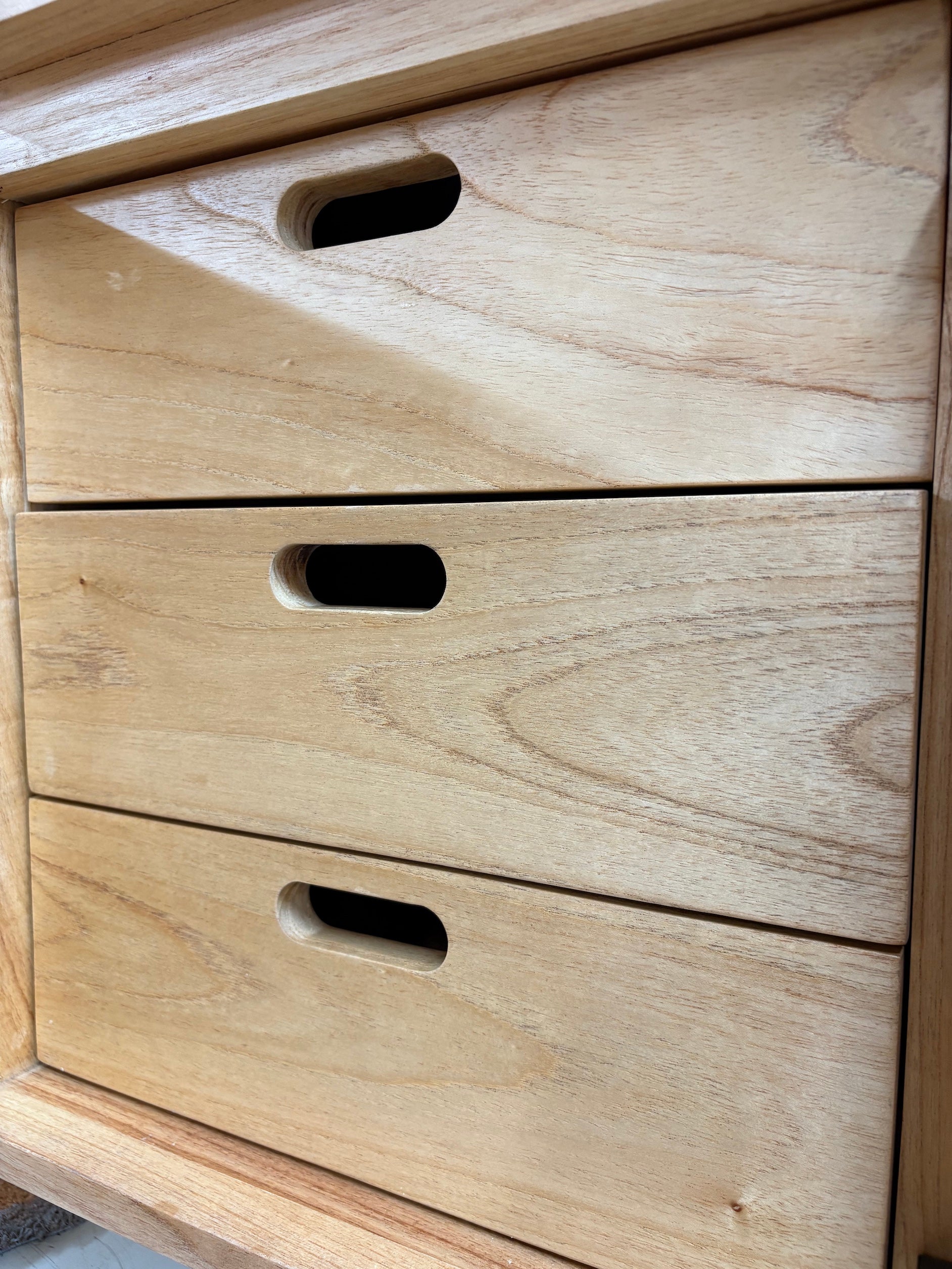 The Eastwood Natural Entertainment Unit. 4 textured doors with smart storage behind the left door featuring 3 drawer. Colour Natural. Measures 1800 wide X 400 depth x 650 height. Drawers.