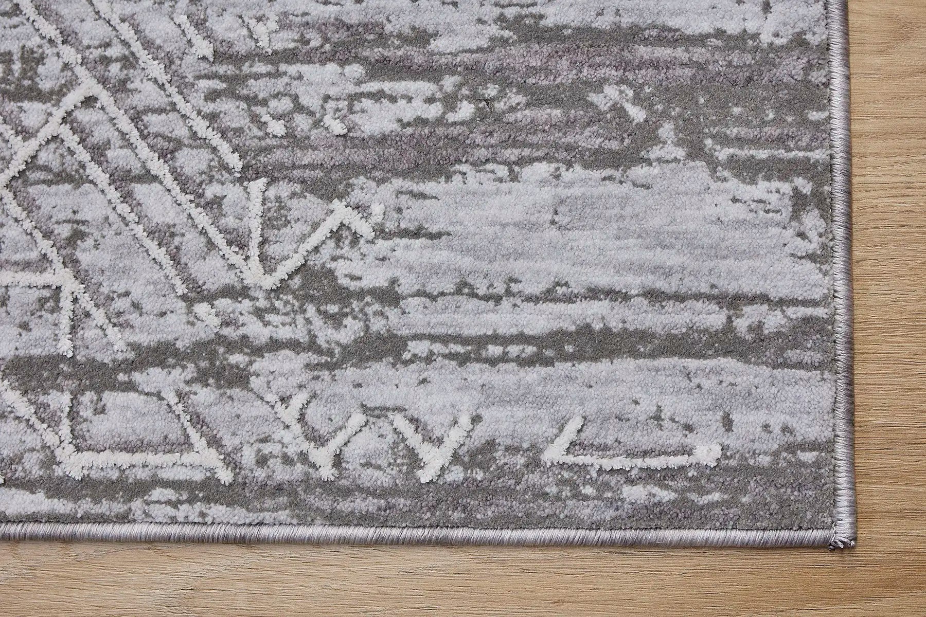 Eclipse Grey is a machine made rug. Its design boasts a geometric modern/contemporary feel. Crafted from Polyester with a low-profile 7-9mm pile height. Colours Grey and light grey tones. Sizes 160 X 230, 200 X 300 and 240 X 340. Corner.