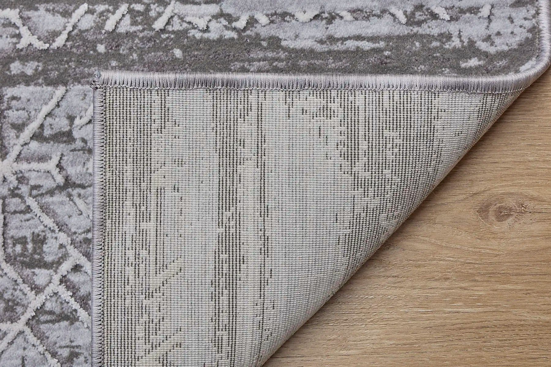 Eclipse Grey is a machine made rug. Its design boasts a geometric modern/contemporary feel. Crafted from Polyester with a low-profile 7-9mm pile height. Colours Grey and light grey tones. Sizes 160 X 230, 200 X 300 and 240 X 340. Fold.