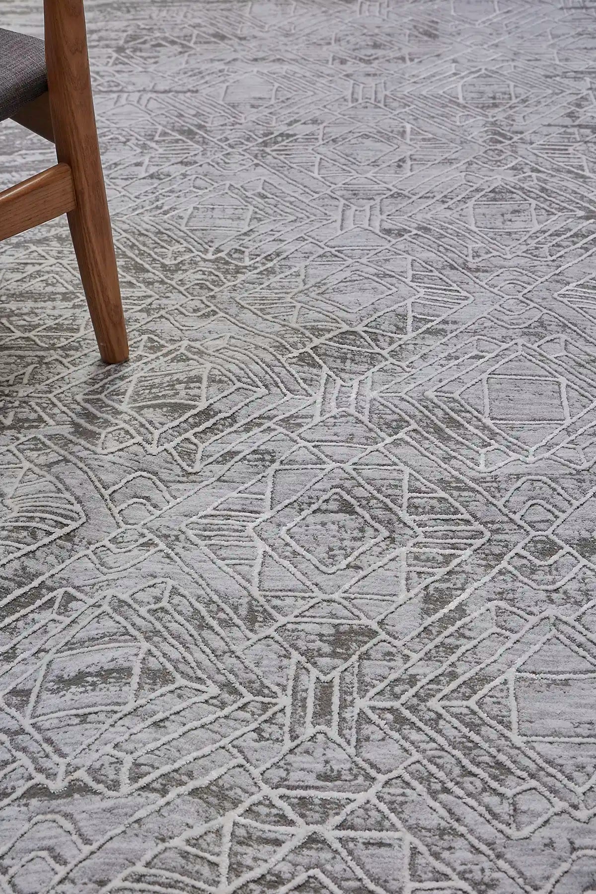 Eclipse Grey is a machine made rug. Its design boasts a geometric modern/contemporary feel. Crafted from Polyester with a low-profile 7-9mm pile height. Colours Grey and light grey tones. Sizes 160 X 230, 200 X 300 and 240 X 340. Life.