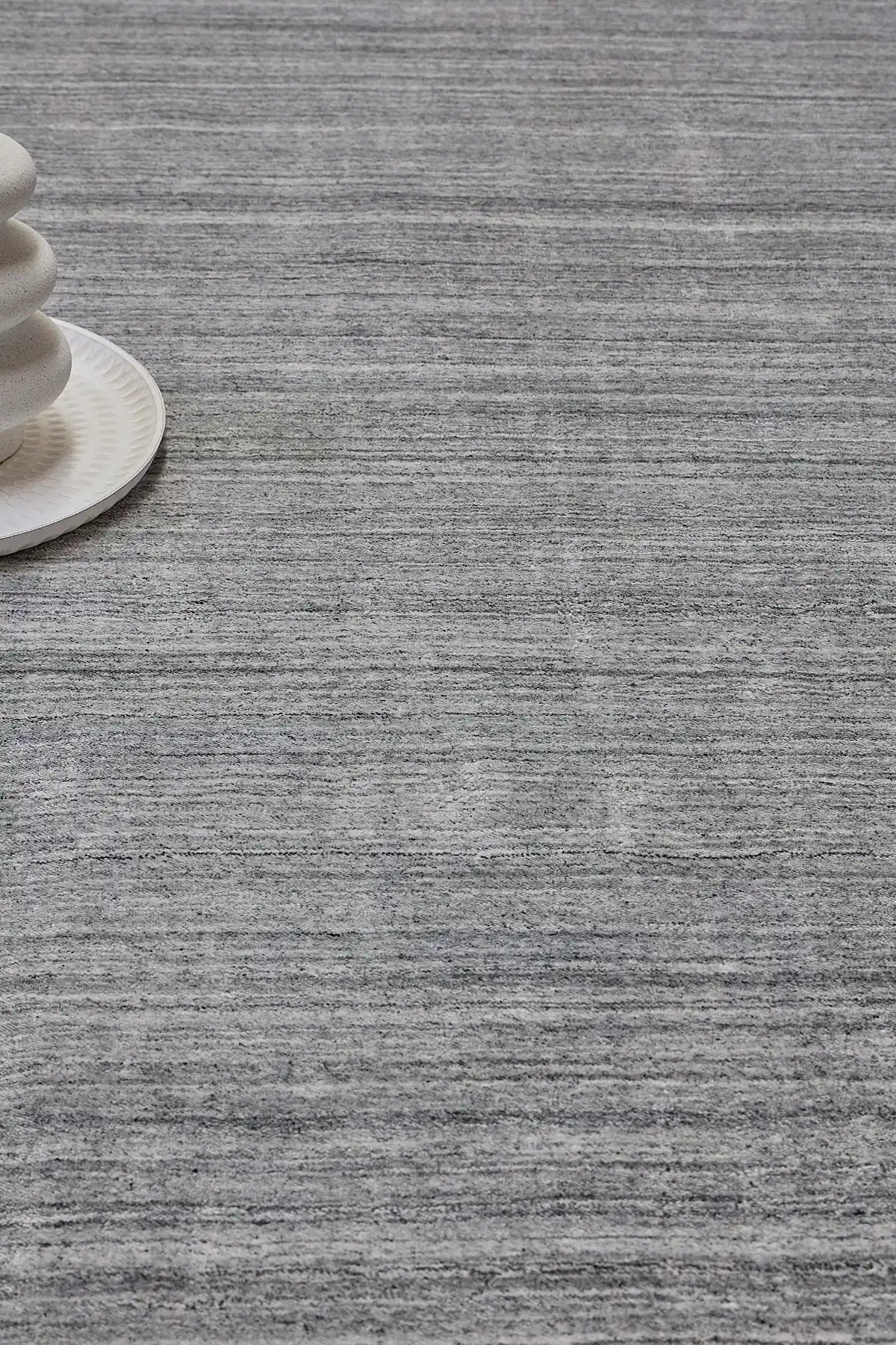 Ethnic Charcoal is a luxurious hand loomed carpet made of 80% wool and 20% bamboo silk. The finely crafted material creates a super soft texture and a smooth pile height of 16-18mm. Colour Charcoal. Sizes 160 X 230,, 200 X 290 and 240 X 340. Life.