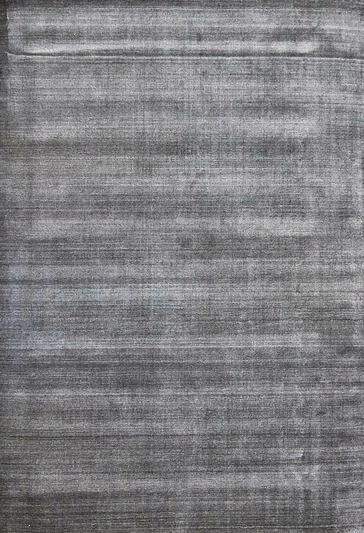Ethnic Charcoal is a luxurious hand loomed carpet made of 80% wool and 20% bamboo silk. The finely crafted material creates a super soft texture and a smooth pile height of 16-18mm. Colour Charcoal. Sizes 160 X 230,, 200 X 290 and 240 X 340. Full.