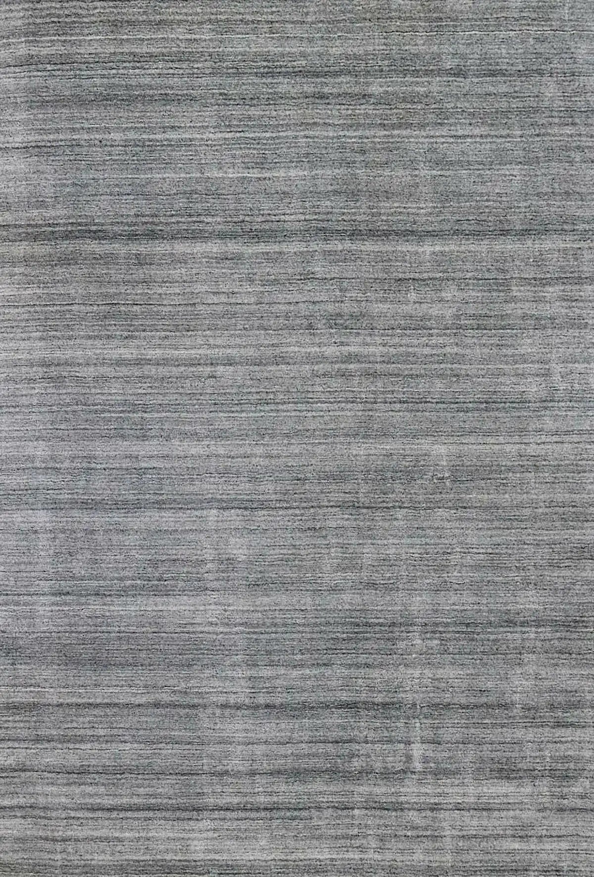 Ethnic Silver is a luxurious hand loomed carpet made of 80% wool and 20% bamboo silk. The finely crafted material creates a super soft texture and a smooth pile height of 16-18mm. Colour Silver. Sizes 160 X 230, 200 X 290 and 240 X 340. Full.