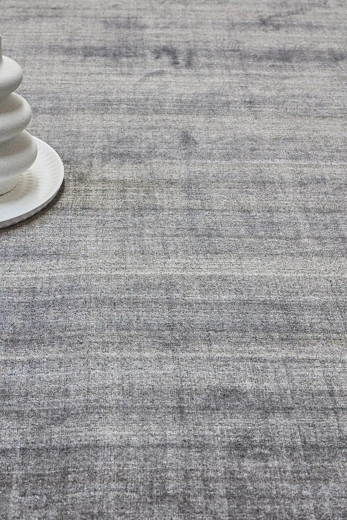 Ethnic Taupe is a luxurious hand loomed carpet made of 80% wool and 20% bamboo silk. The finely crafted material creates a super soft texture and a smooth pile height of 16-18mm. Colour Silver Beige. Sizes 160 X 230, 200 X 290 and 240 X 340. Life.