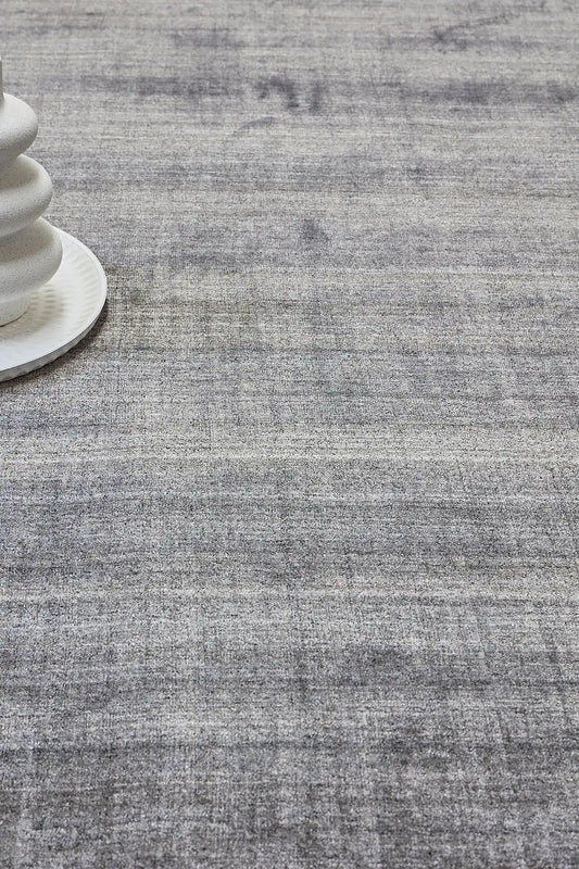 Ethnic Taupe is a luxurious hand loomed carpet made of 80% wool and 20% bamboo silk. The finely crafted material creates a super soft texture and a smooth pile height of 16-18mm. Colour Silver Beige. Sizes 160 X 230, 200 X 290 and 240 X 340. Life.