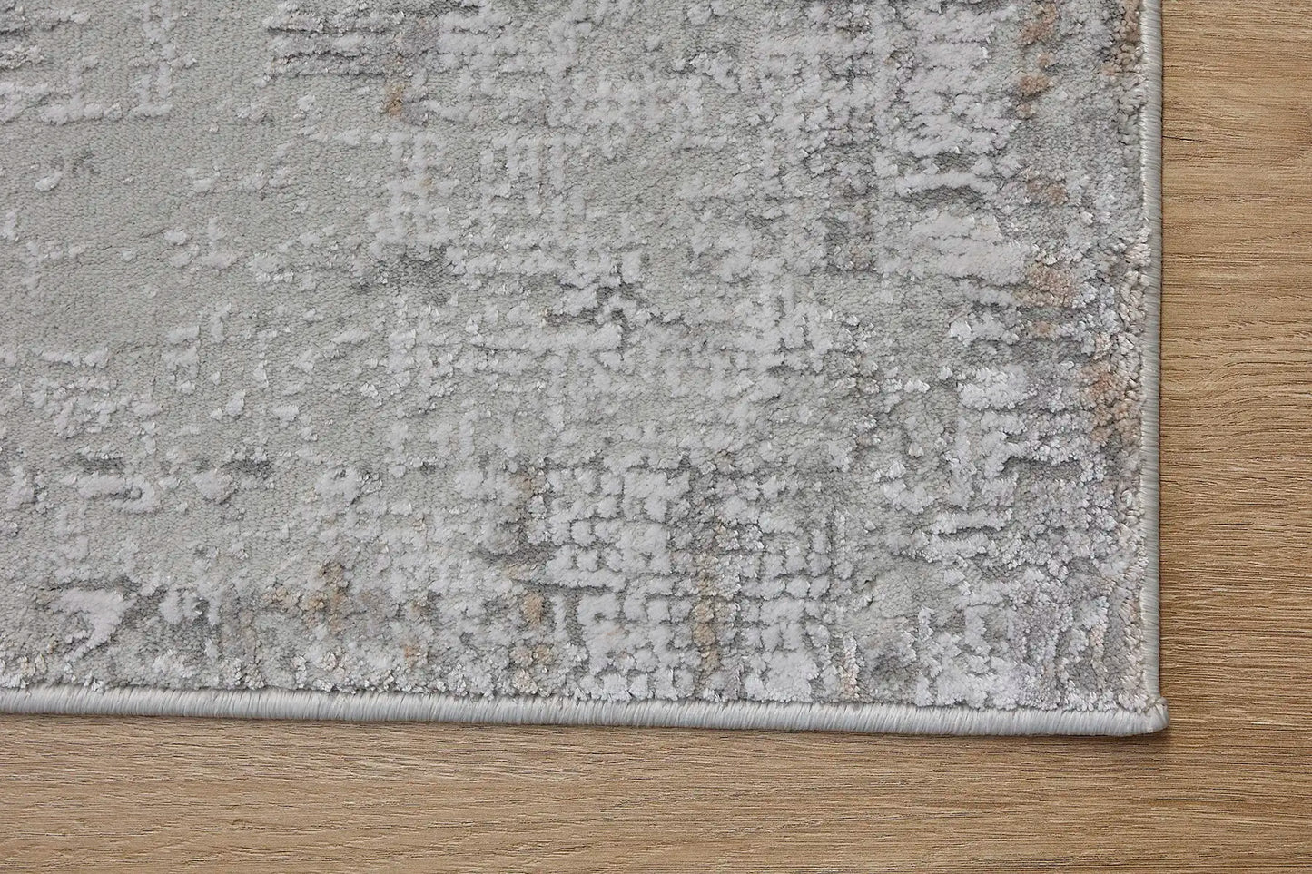 Finesse Grey is a machine made rug. Its design boasts a geometric modern/contemporary feel. Crafted from Viscose and Polyester, with a low-profile 7-9mm pile height. Colours Grey, Light Grey and Beige tones. Sizes 160 X 230, 200 X 300 and 240 X 340. Corner.