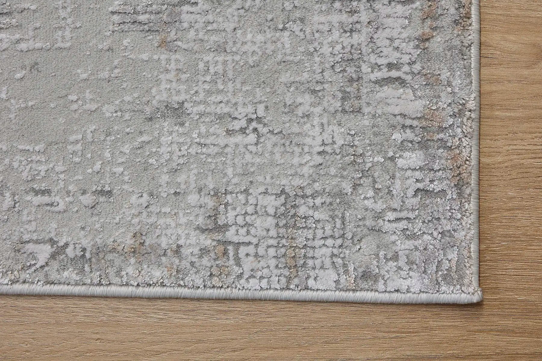 Finesse Grey is a machine made rug. Its design boasts a geometric modern/contemporary feel. Crafted from Viscose and Polyester, with a low-profile 7-9mm pile height. Colours Grey, Light Grey and Beige tones. Sizes 160 X 230, 200 X 300 and 240 X 340. Corner.