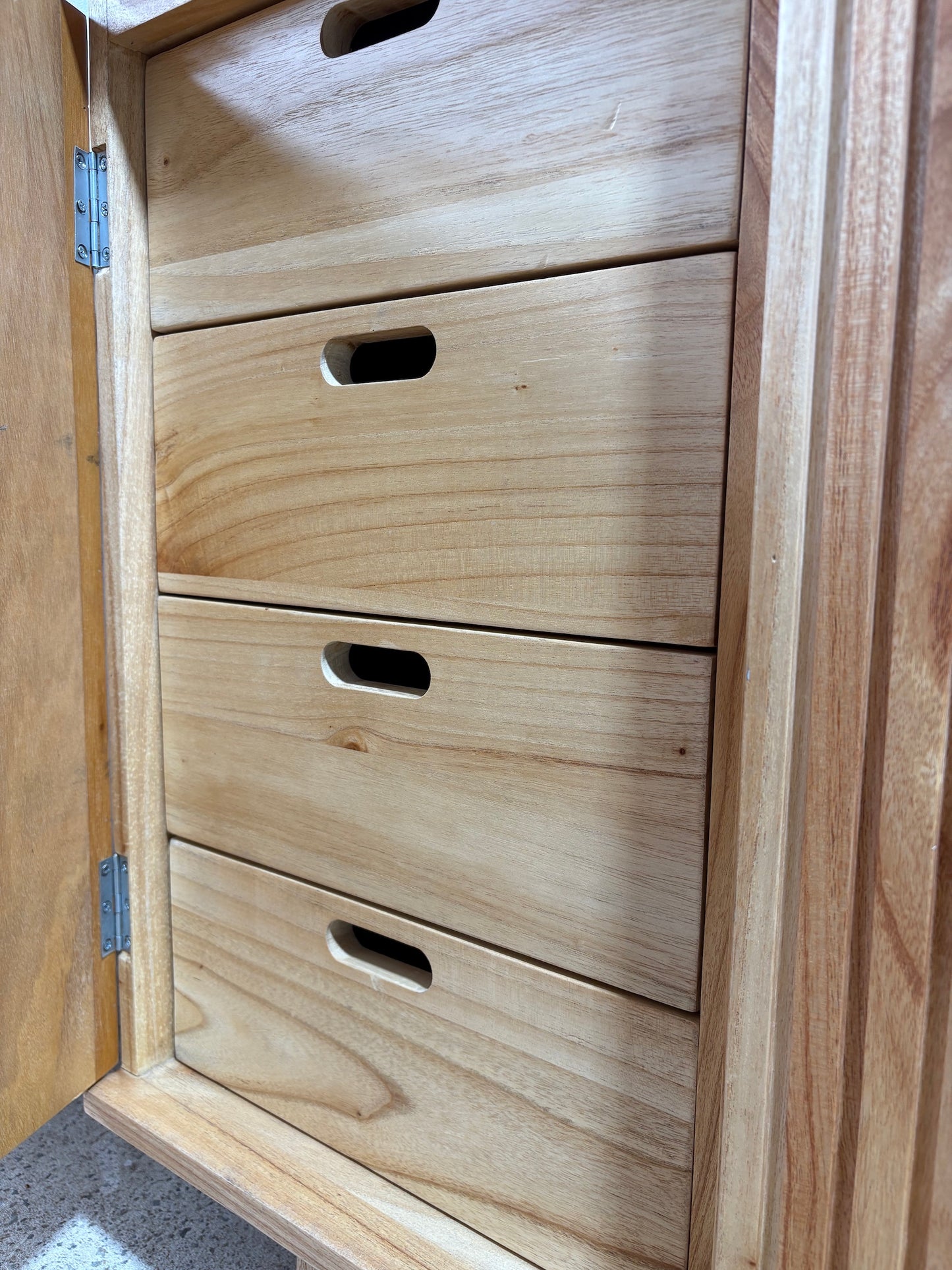 The Florence Natural Buffet. 4 textured doors with smart storage behind the left door featuring 4 drawers. Colour Natural. Measures 1800 wide X 400 depth x 900 height. Drawers.