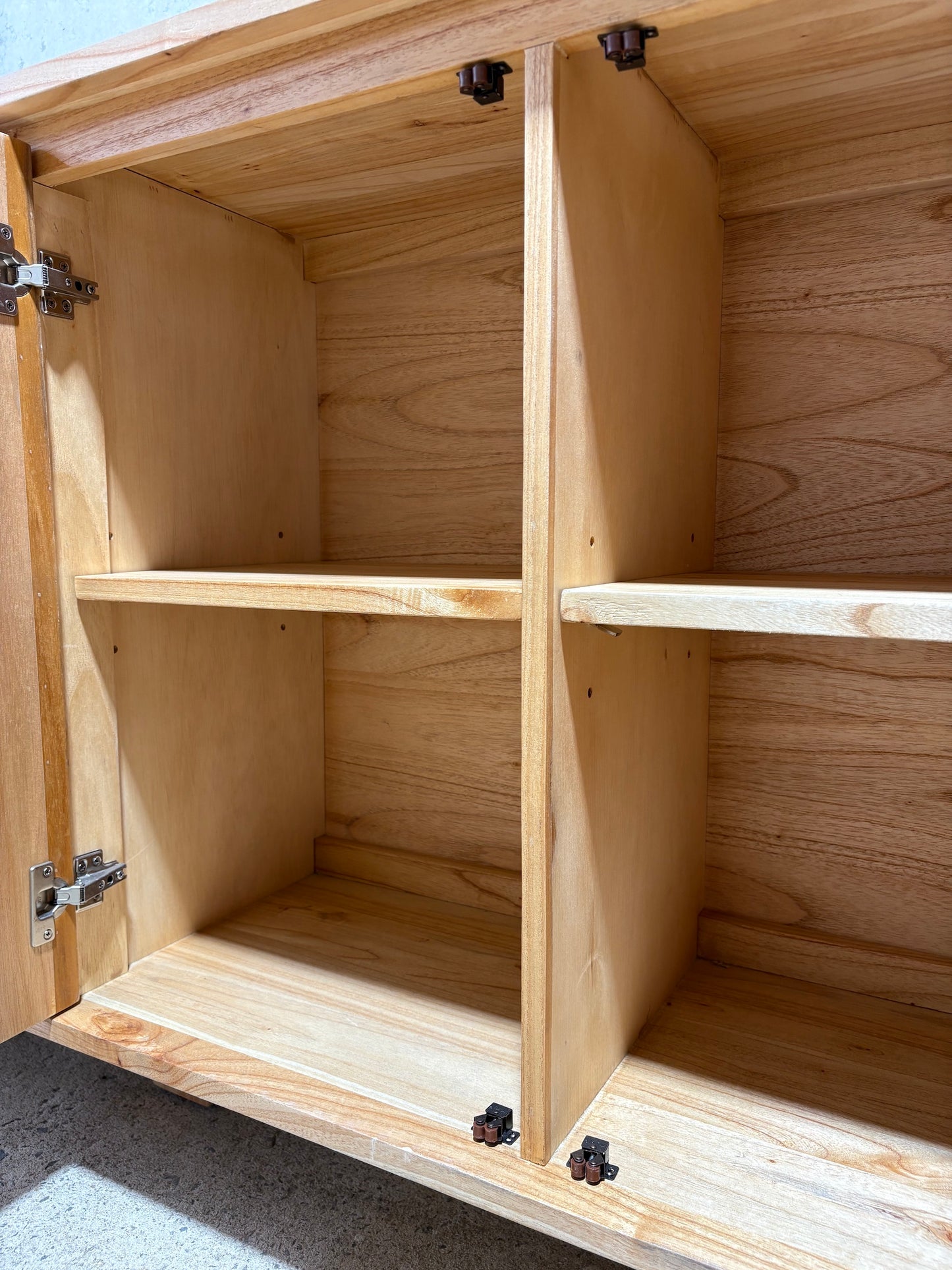 The Florence Natural Buffet. 4 textured doors with smart storage behind the left door featuring 4 drawers. Colour Natural. Measures 1800 wide X 400 depth x 900 height. Shelves.