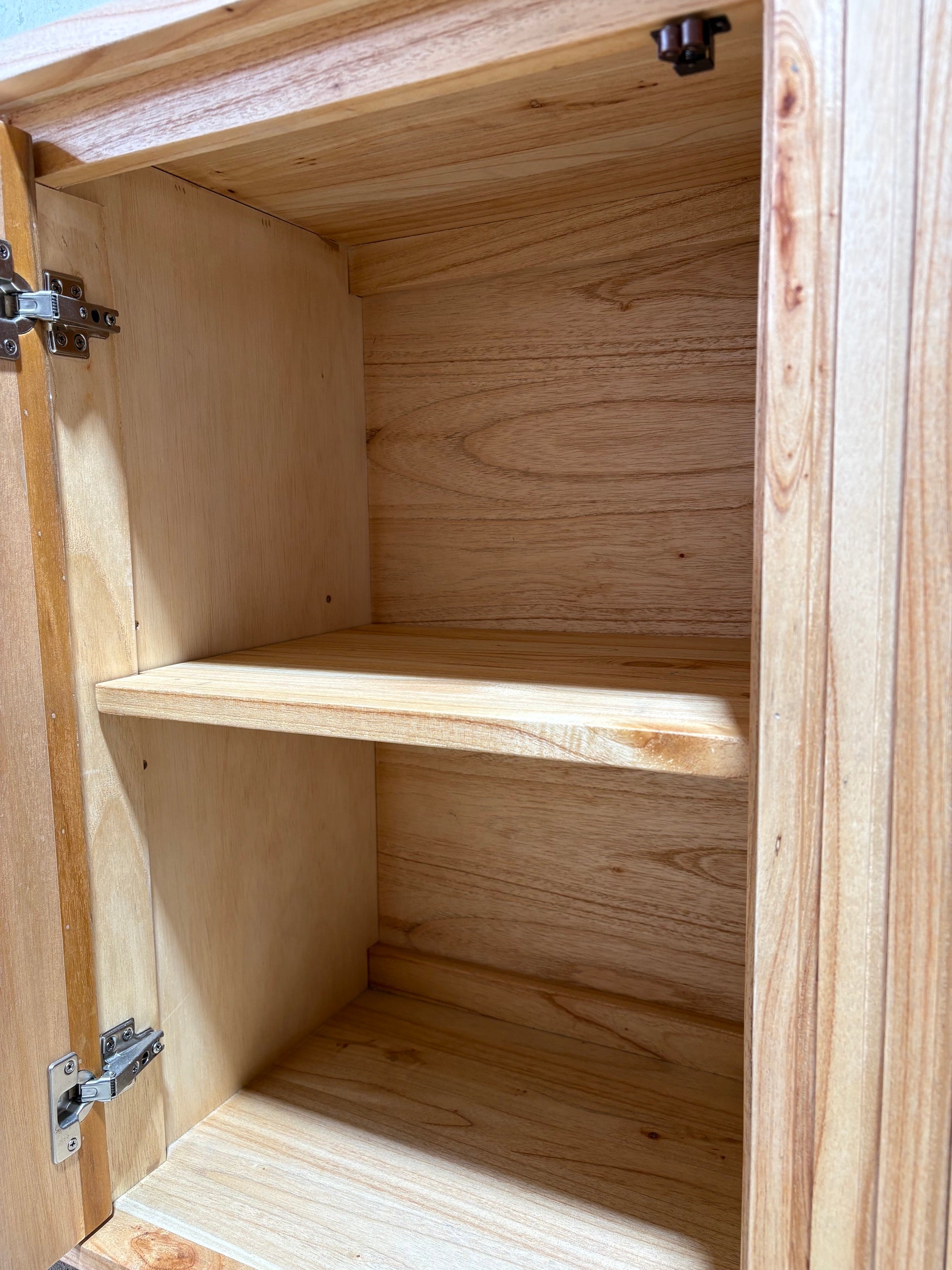 The Florence Natural Buffet. 4 textured doors with smart storage behind the left door featuring 4 drawers. Colour Natural. Measures 1800 wide X 400 depth x 900 height. Inside Shelves.