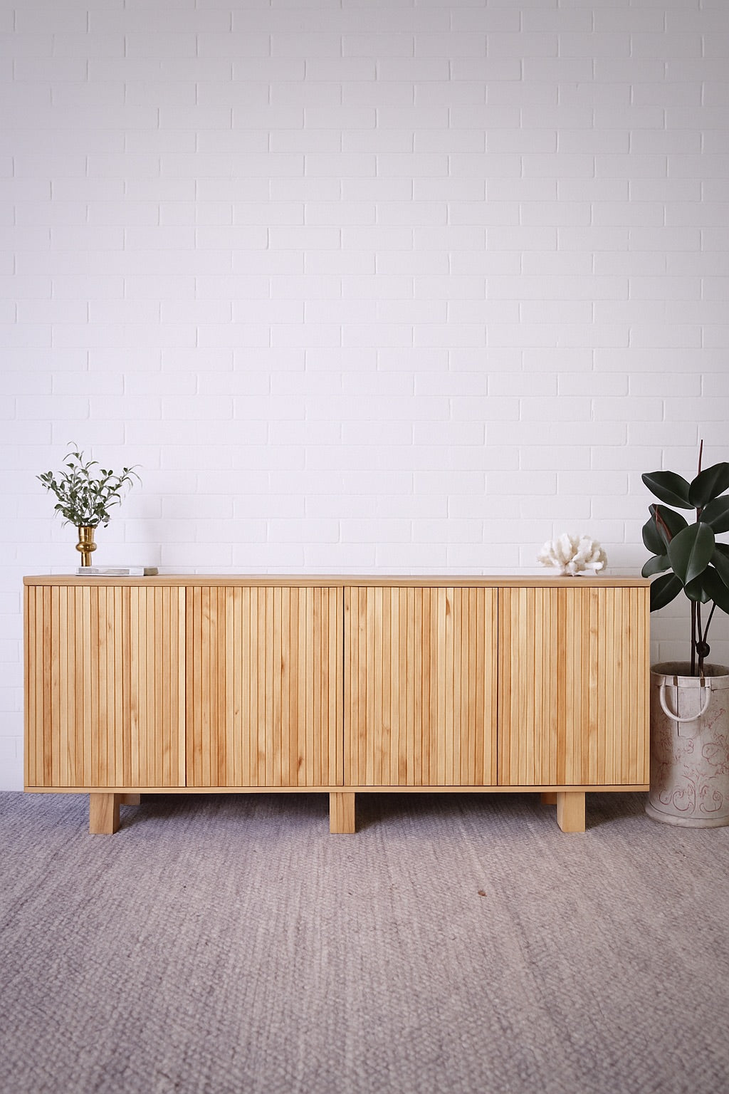 The Florence Natural Buffet. 4 textured doors with smart storage behind the left door featuring 4 drawers. Colour Natural. Measures 1800 wide X 400 depth x 900 height. Styled.